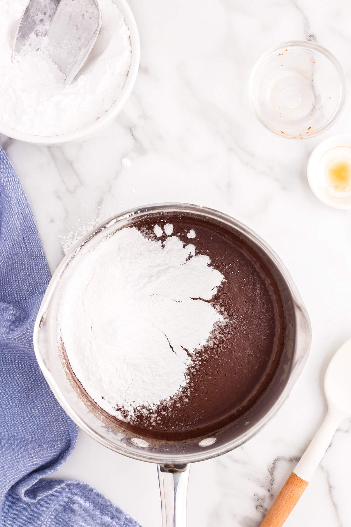 Ingredients for frosting in stovetop saucepan for Texas Sheet Cake recipe