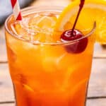 Alabama Slammer cocktail with cherry and orange slice