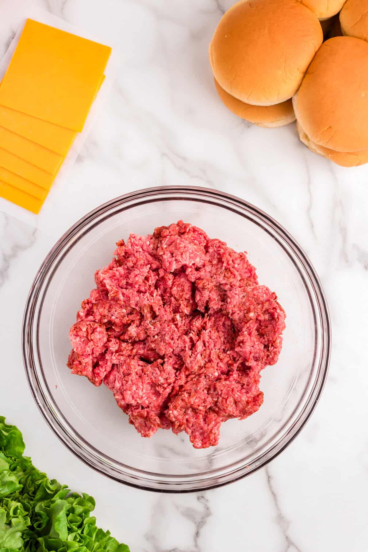 Ground beef in mixing bowl for Baked Hamburgers recipe
