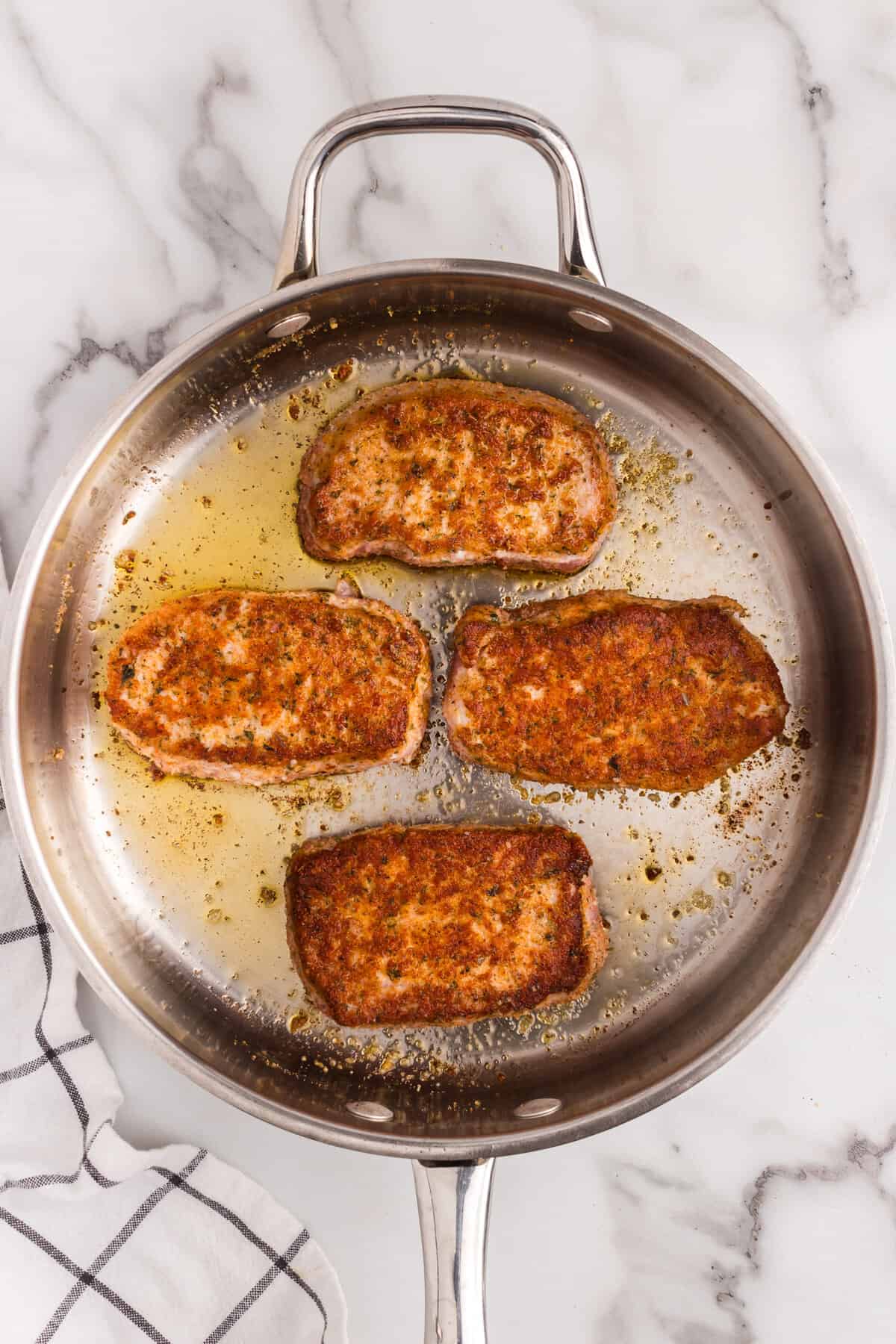 Parmesan Crusted Pork Chops in stovetop skillet