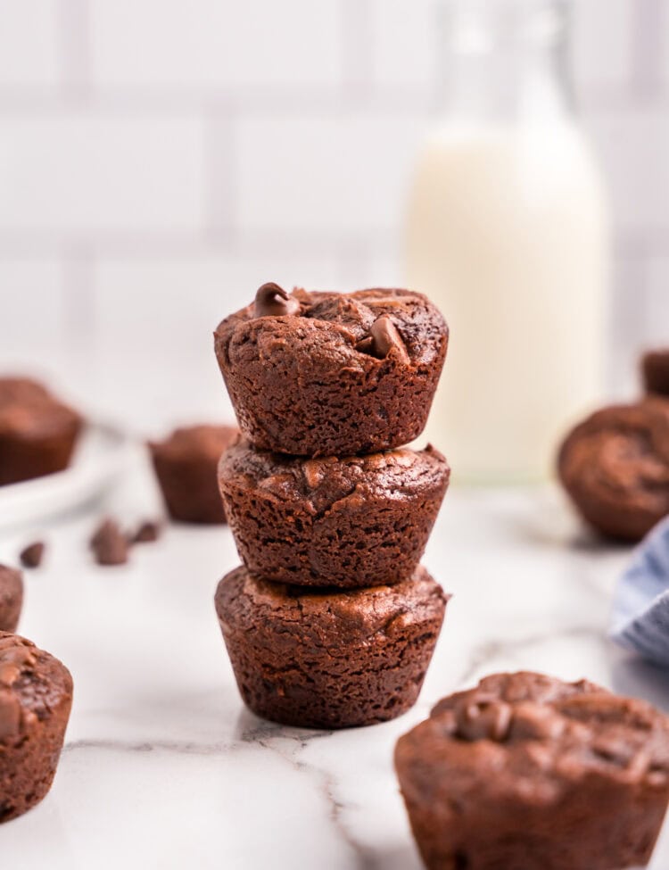 Three brownie bites stacked on top of one another.