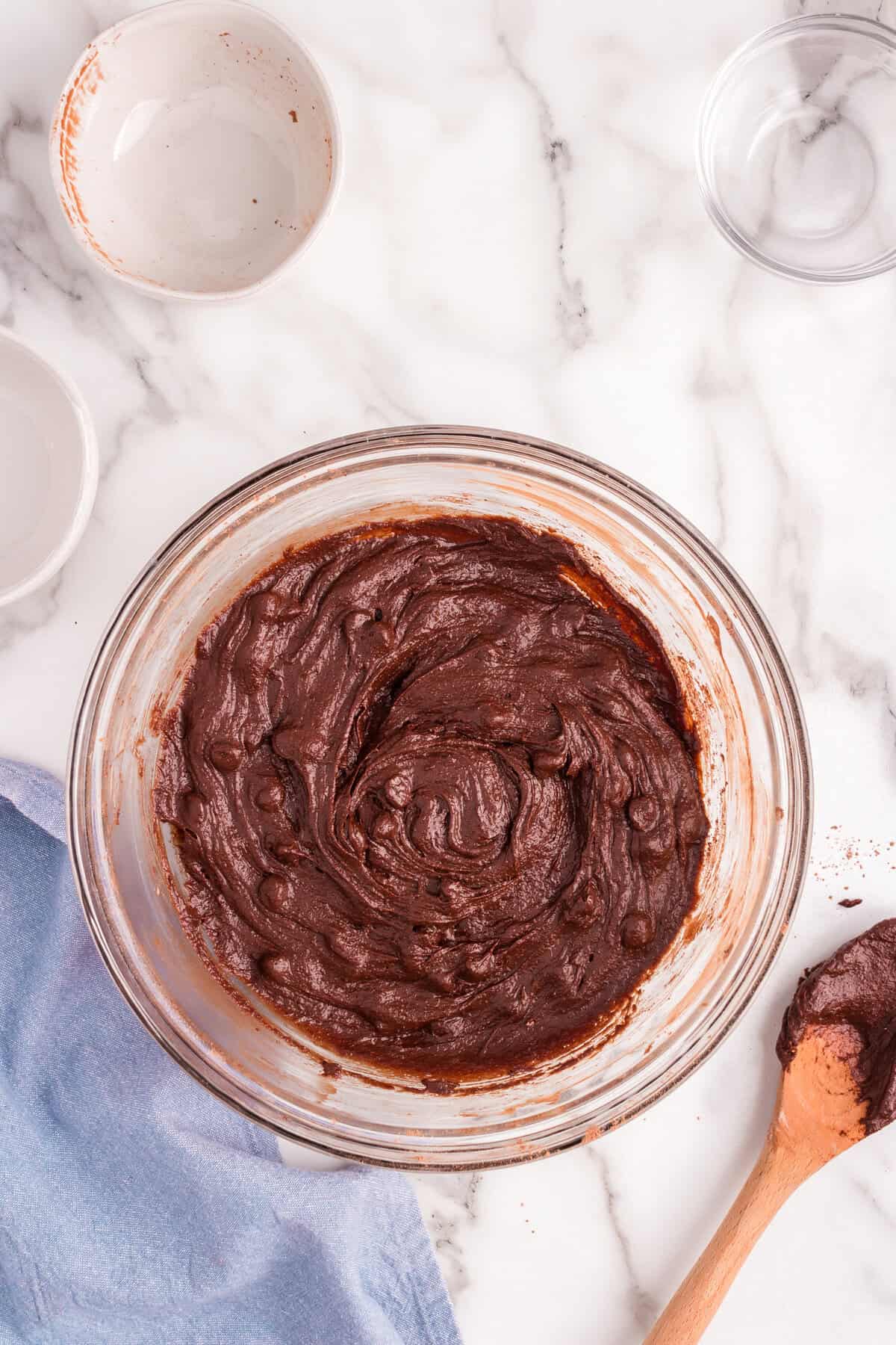 Brownie batter ready to be scooped into a mini muffin pan.