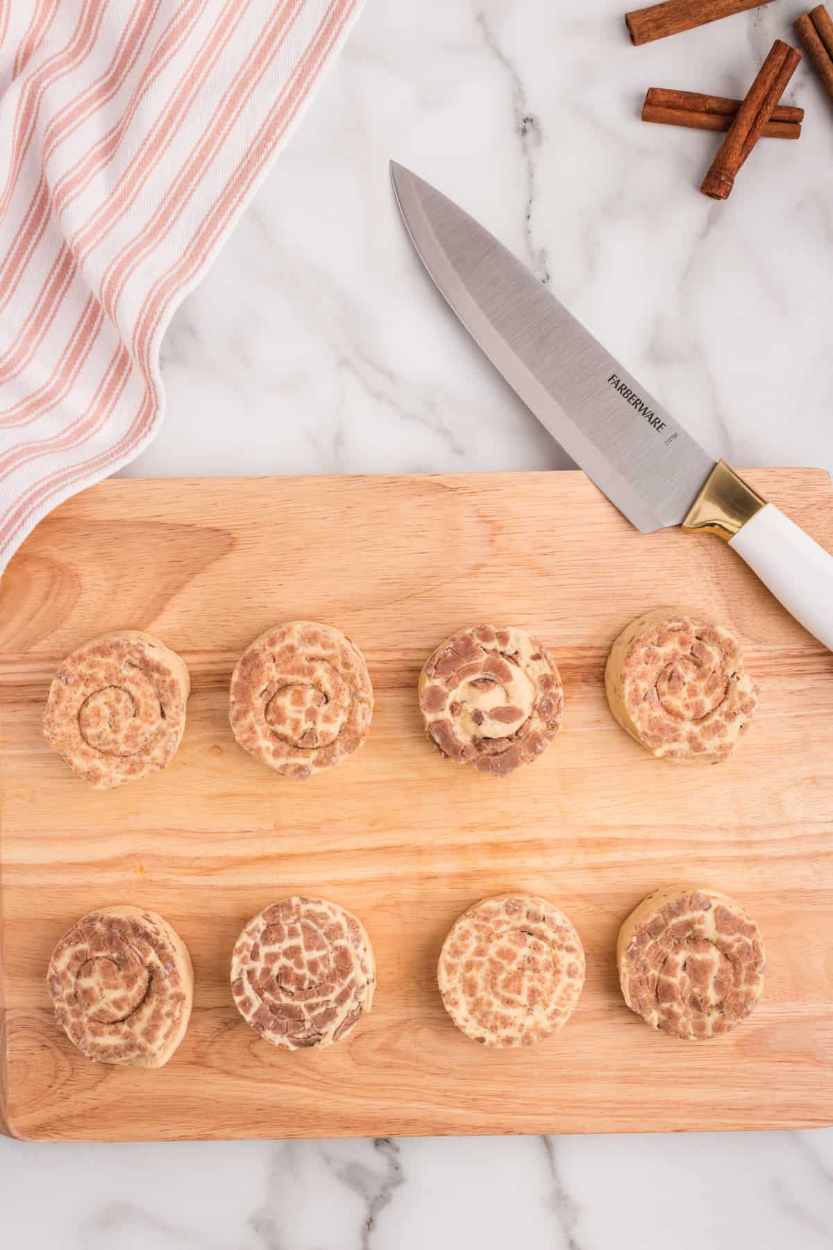 Take the Cinnamon Rolls out of the container and lay them on a cutting board.