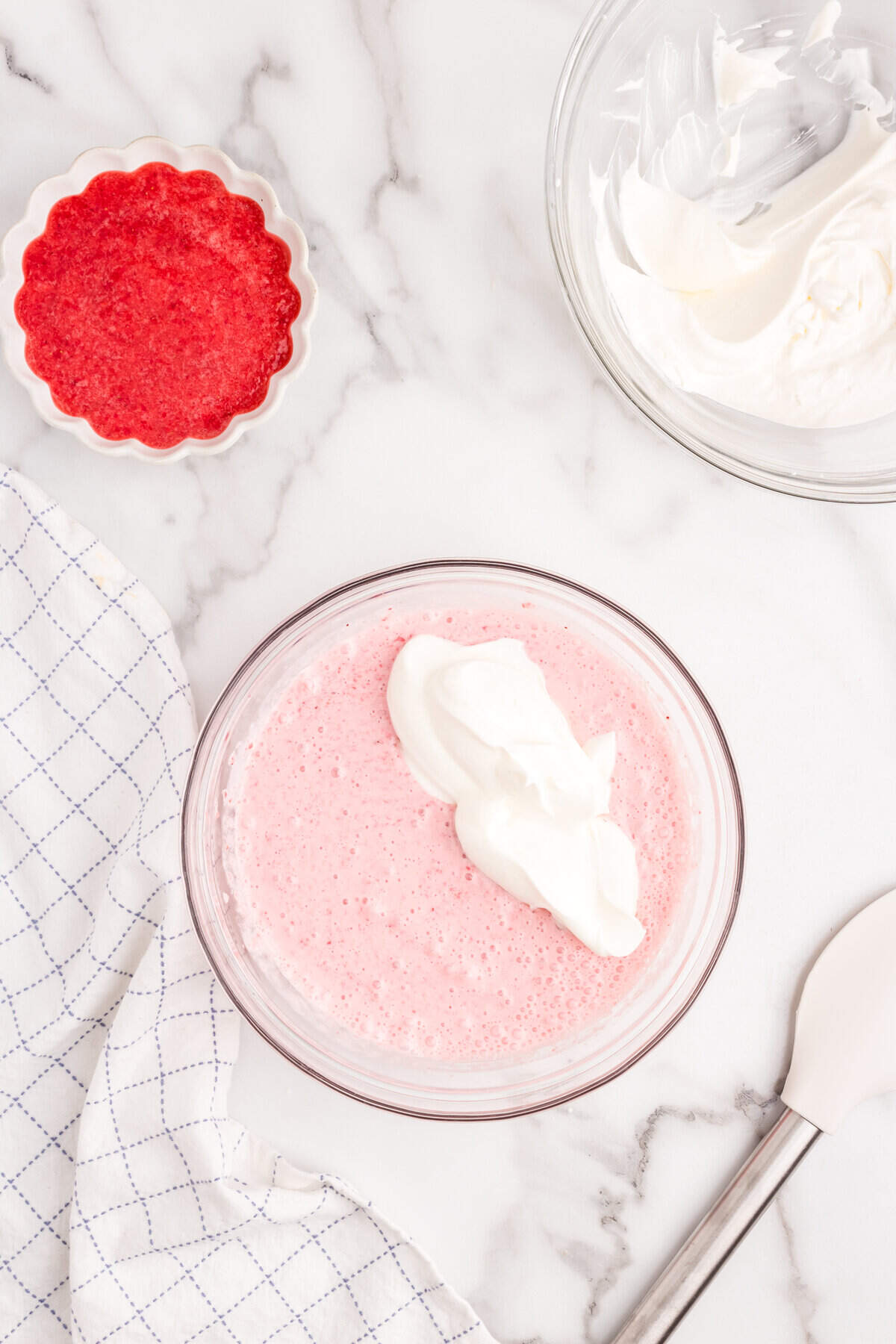 Mixing in more whipped cream to puree mixture for Strawberry Mousse