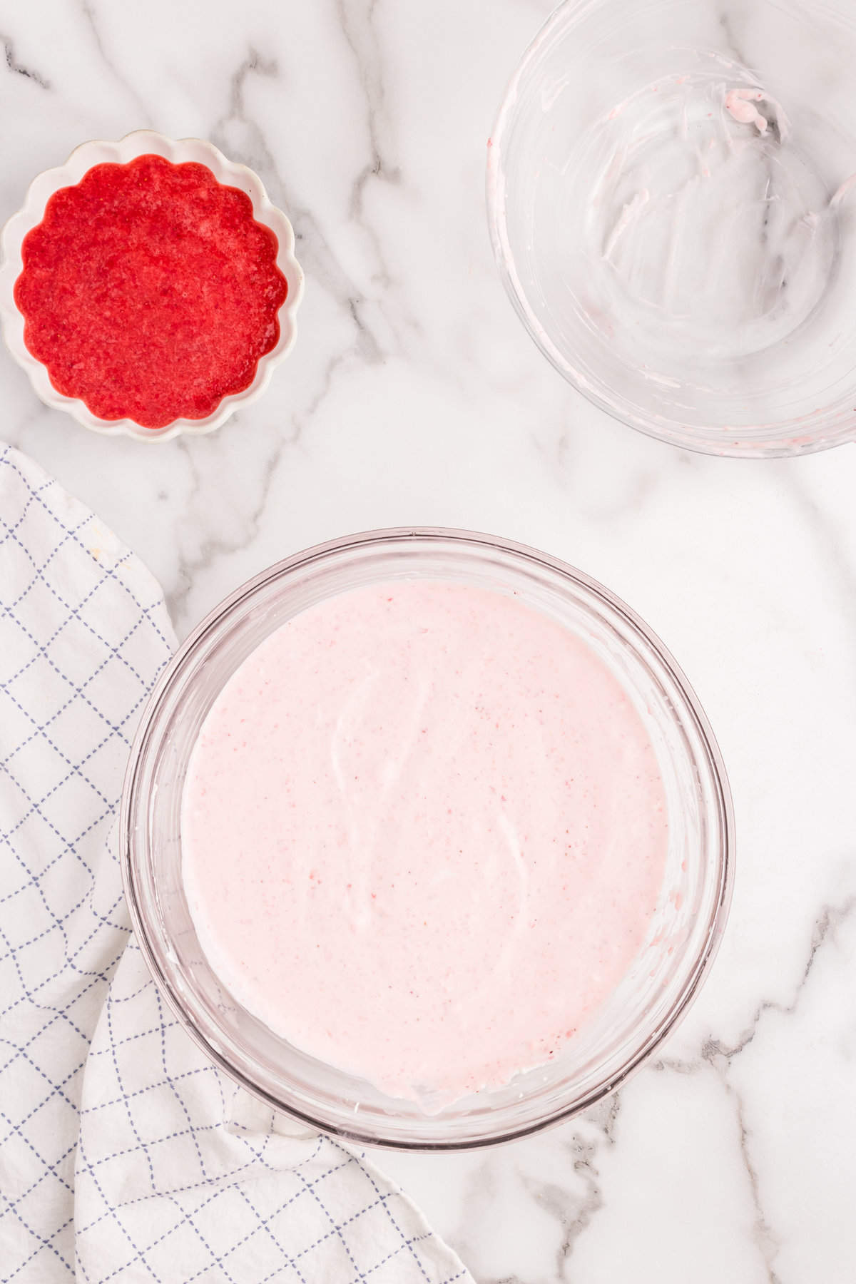 Cream and strawberry puree in mixing bowl for Strawberry Mousse