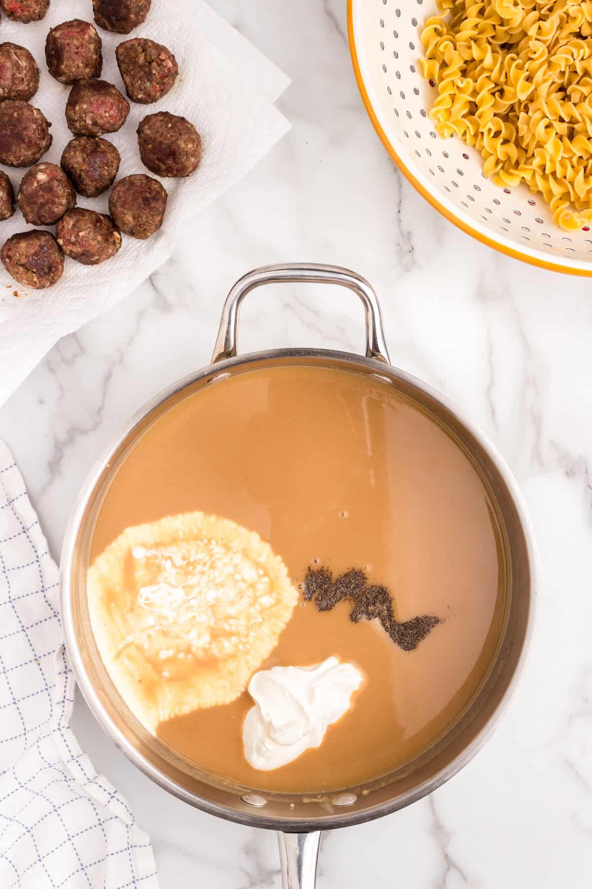 Ingredients for Swedish Meatball Casserole gracy in stovetop skillet