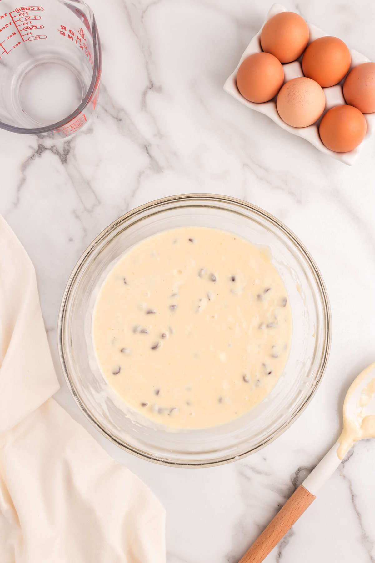 Pancake mix rested and ready to cook in a pan.