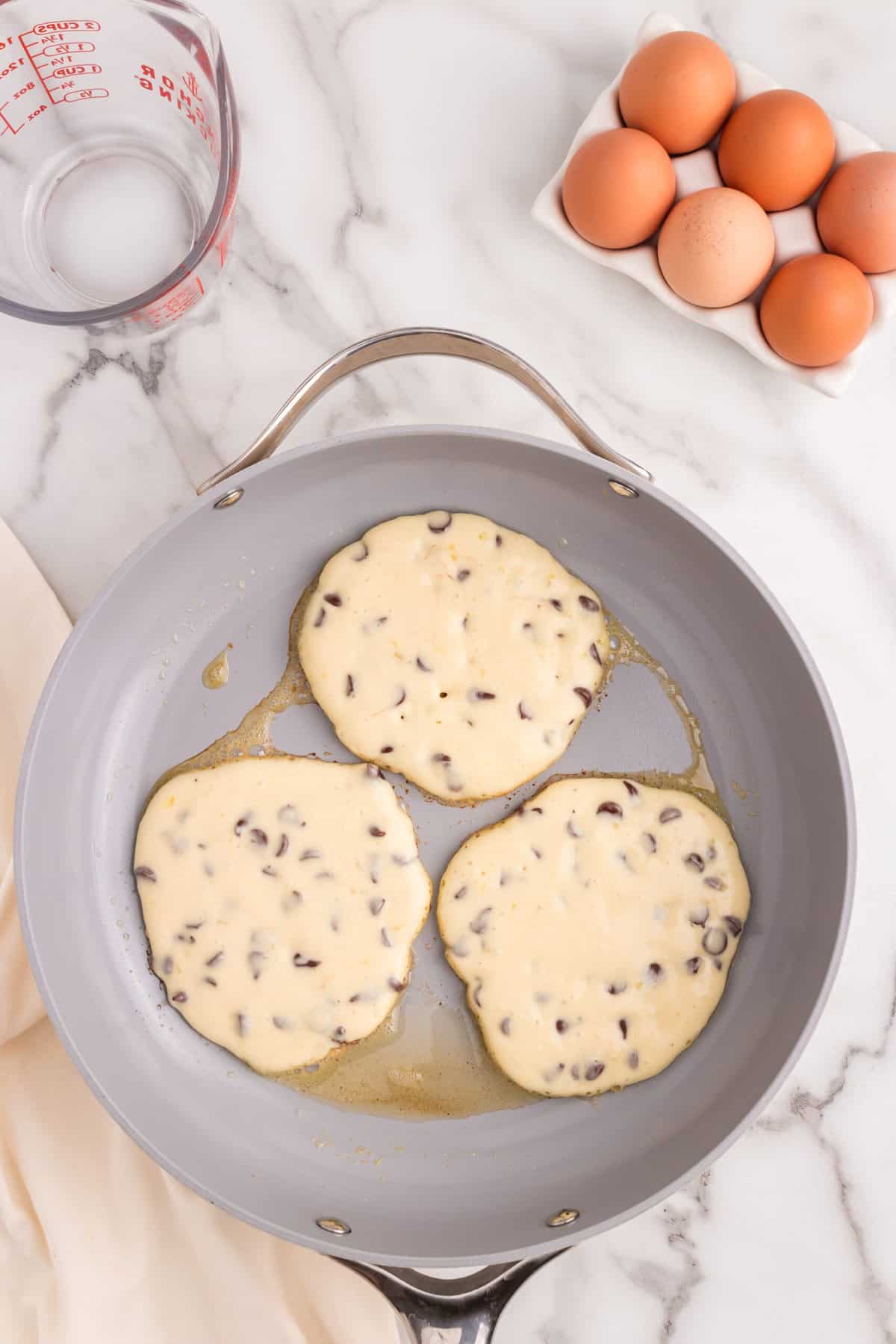 Ladle the batter into the pan and make 3-4 pancakes. Wait until you see bubbles to flip