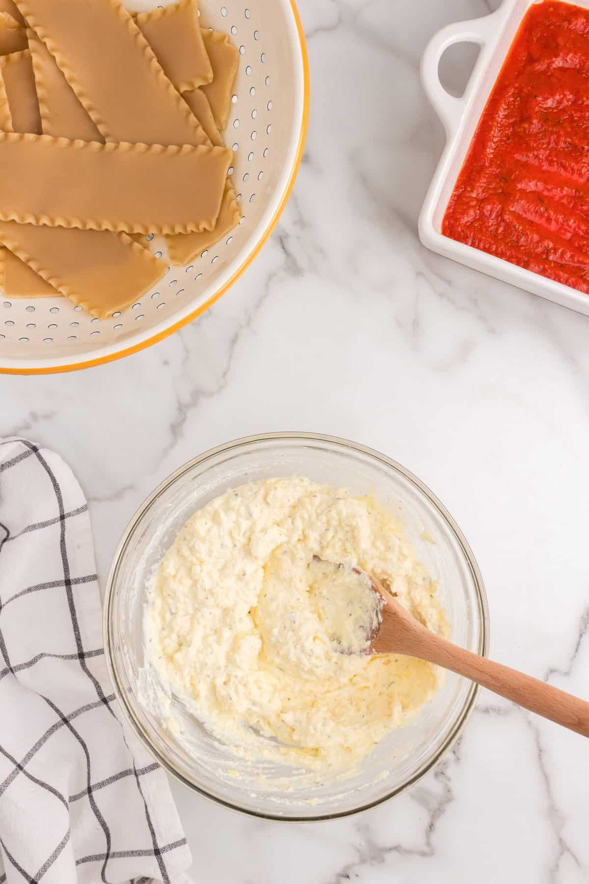 Cheese ingredients for Lasagna Roll Ups in mixing bowl