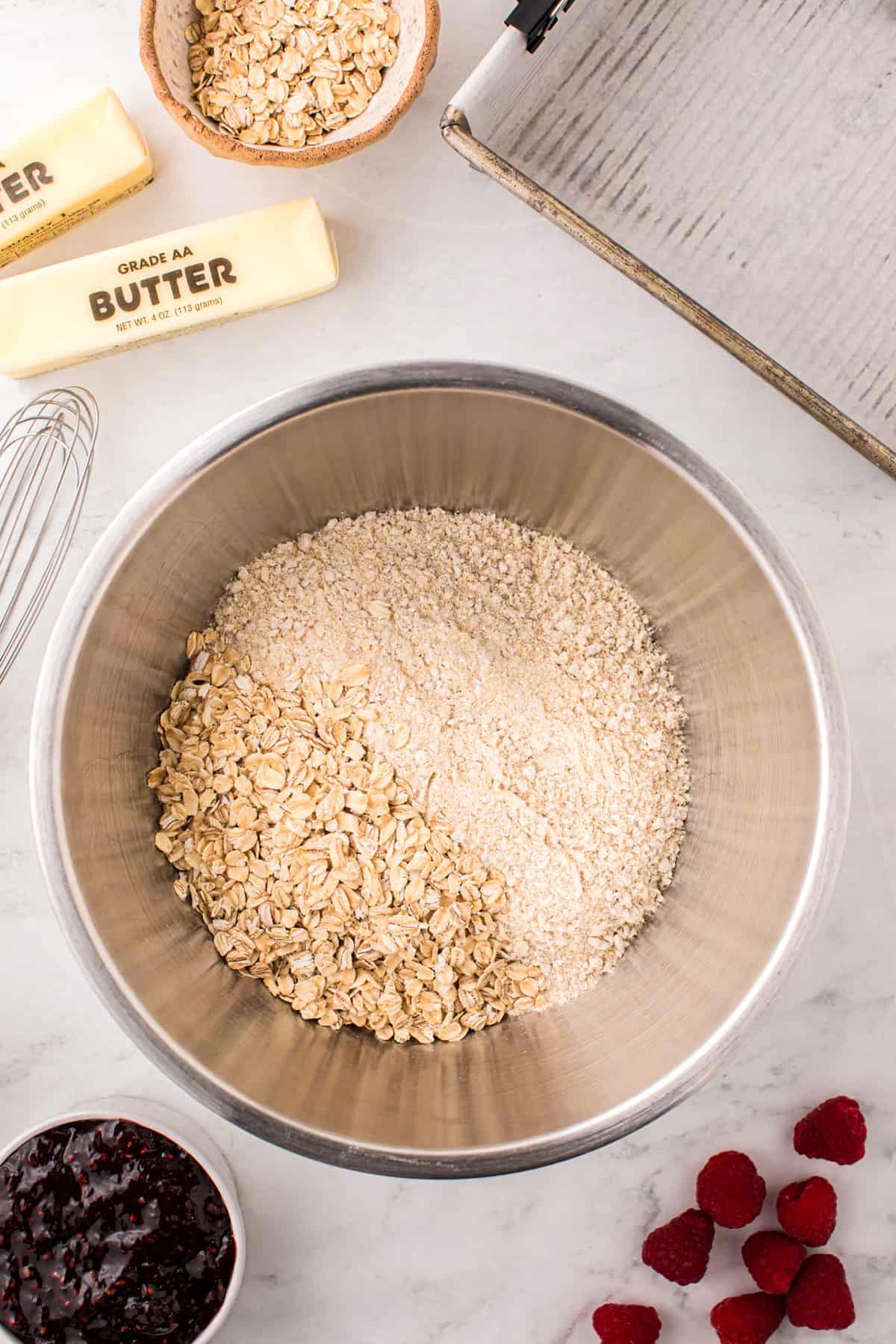 Mixing dry ingredients in mixing bowl for Raspberry Crumble Bars 