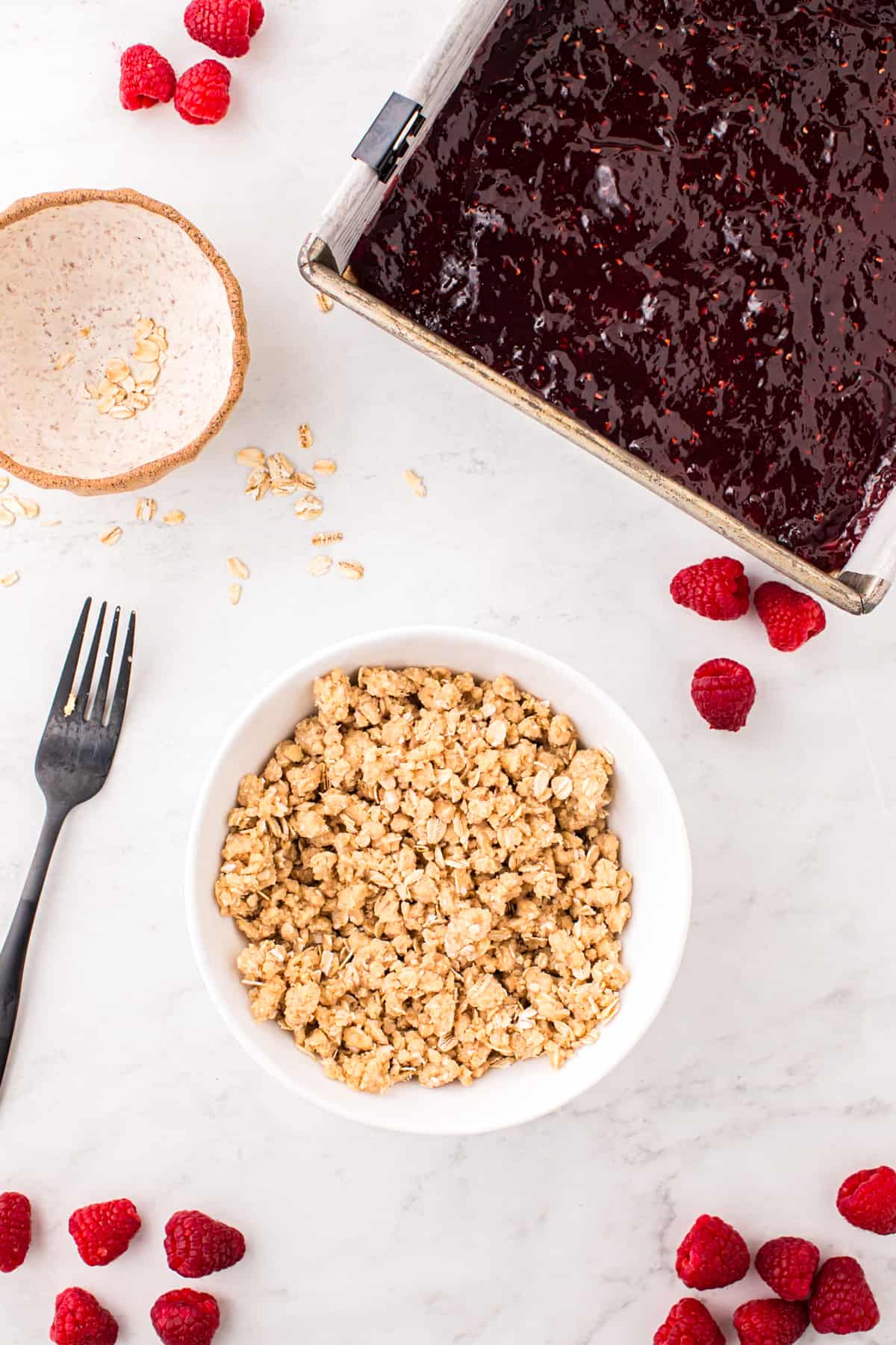 Preparing topping for Raspberry Crumble Bars in small mixing bowl