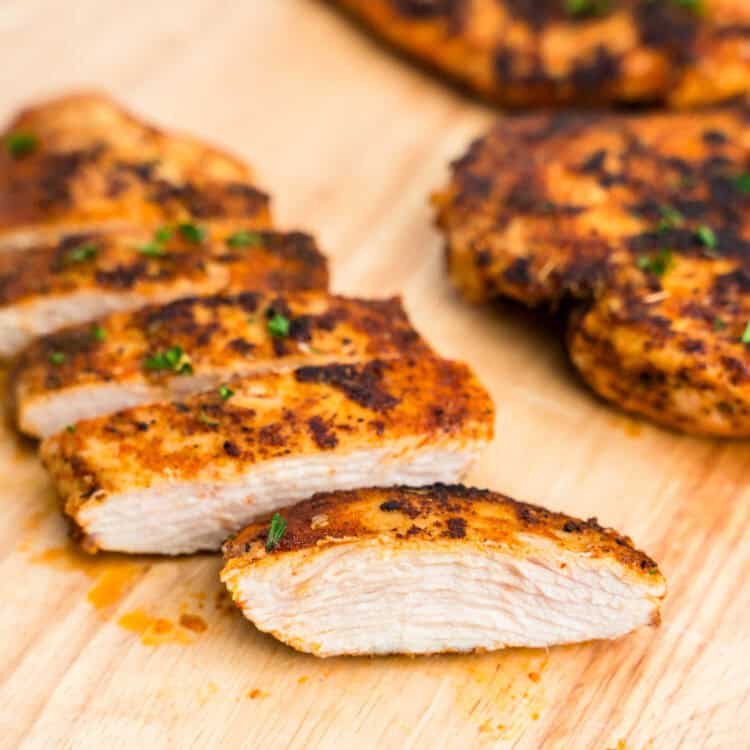 Blackened Chicken sliced on wooden cutting board