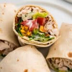 Chicken Bacon Ranch Wrap sliced in half and stacked on plate