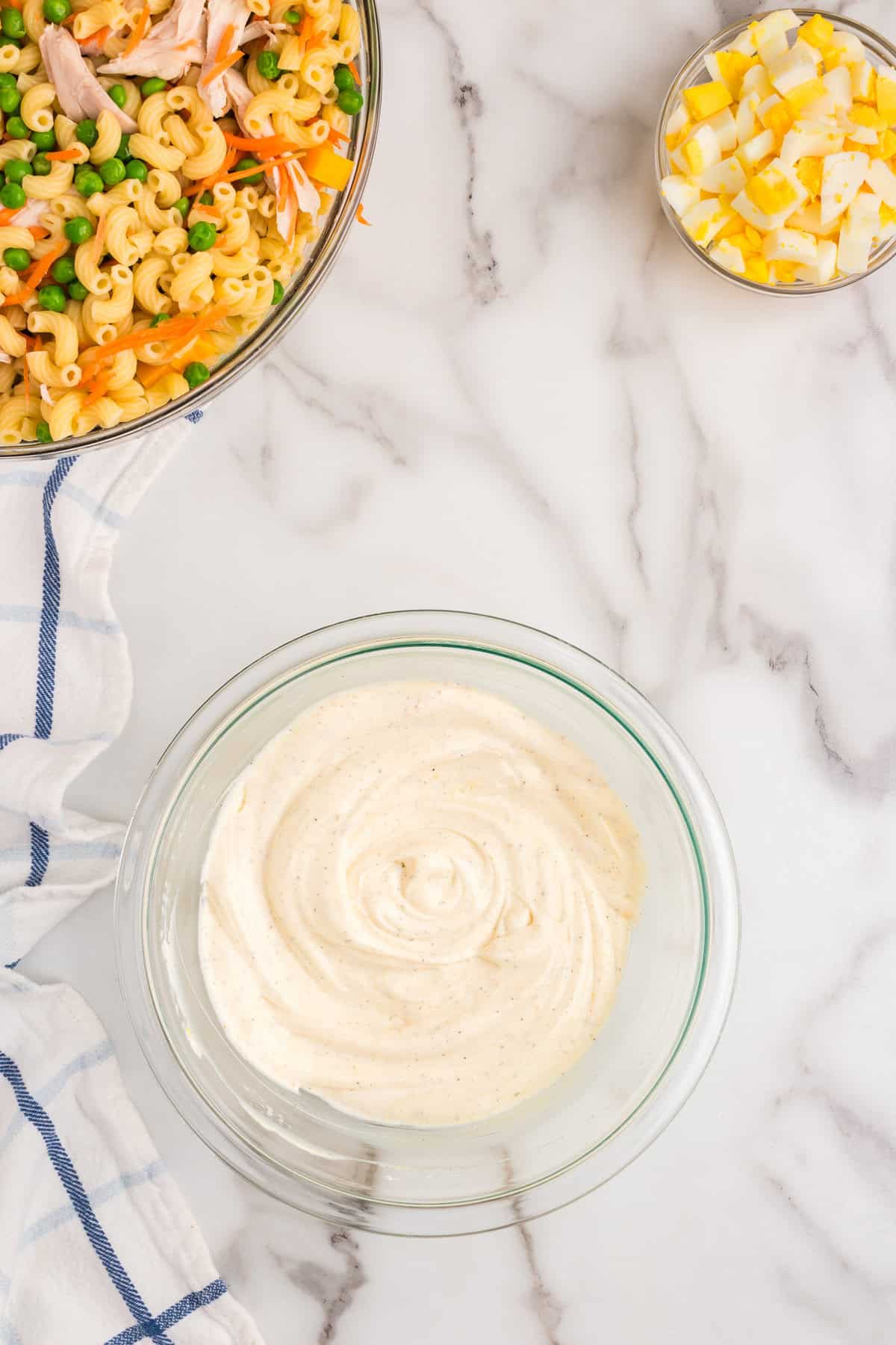 Seasoned and combined dressing in small bowl for Chicken Macaroni Salad