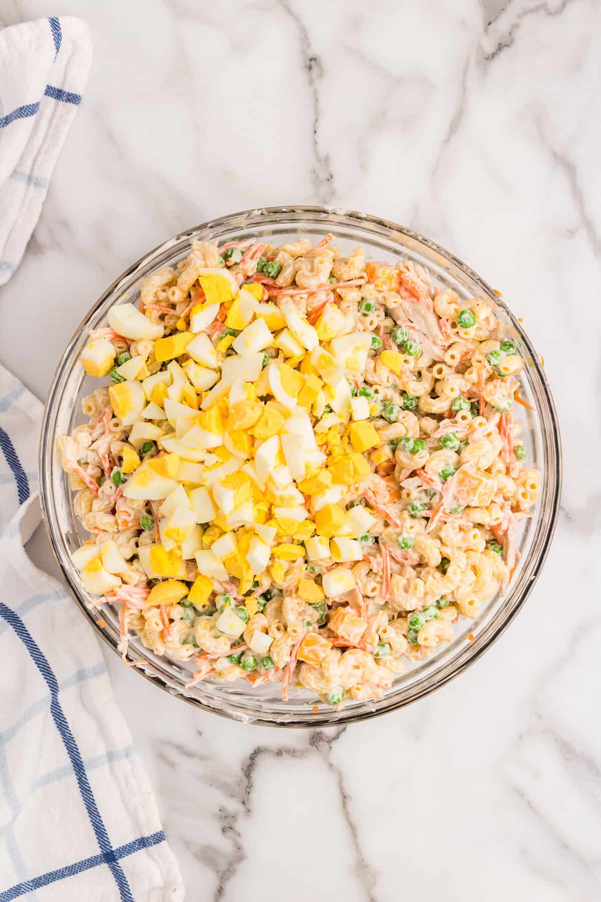 Added hard boiled eggs to mixture for Chicken Macaroni Salad