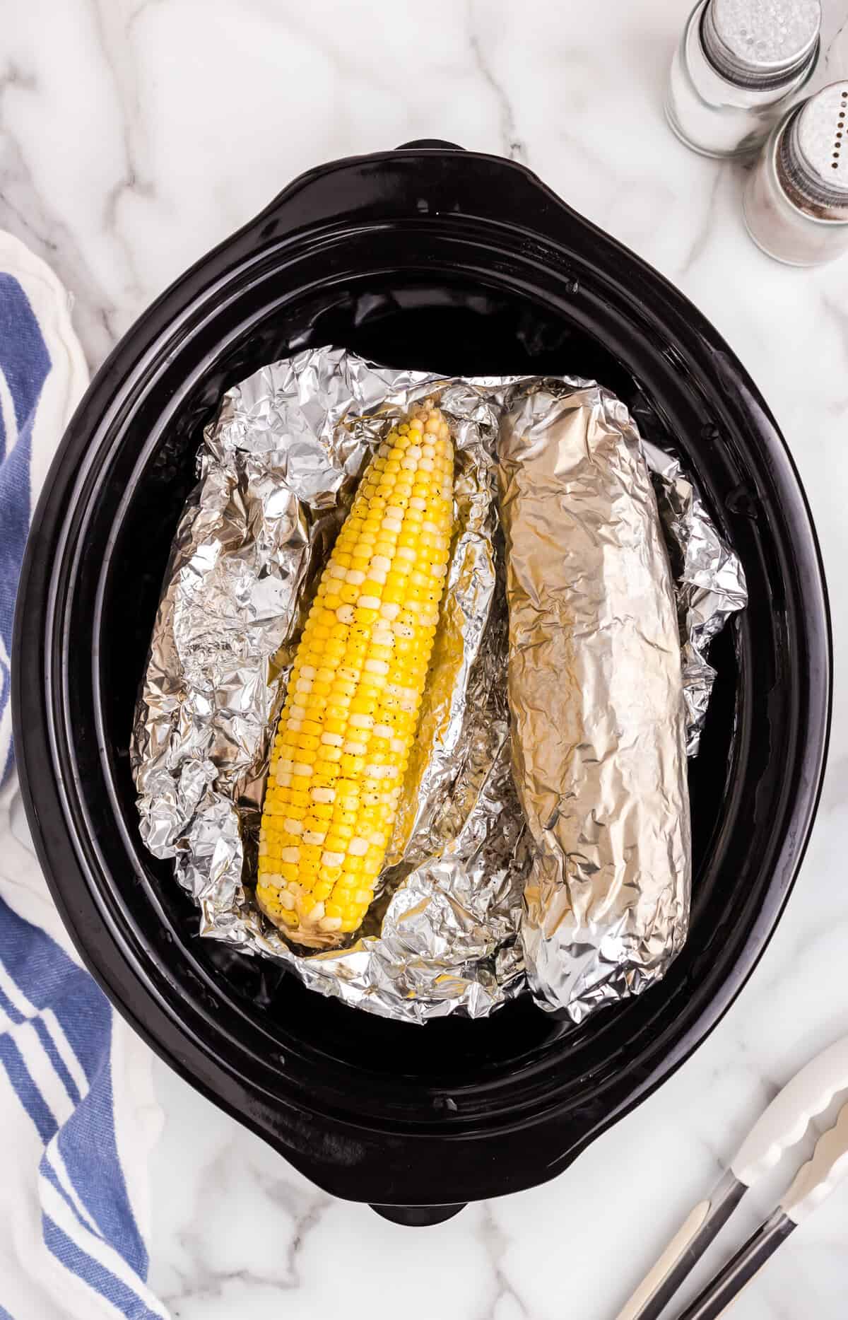 Crock Pot Corn on the Cob recipe with tinfoil rolled cobs