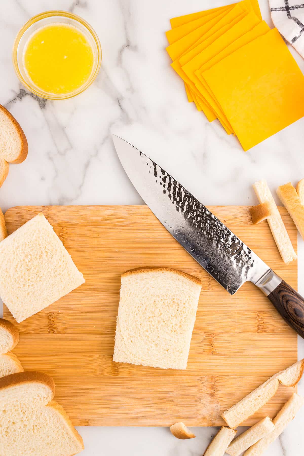 Cut the crust off of each slice of bread.