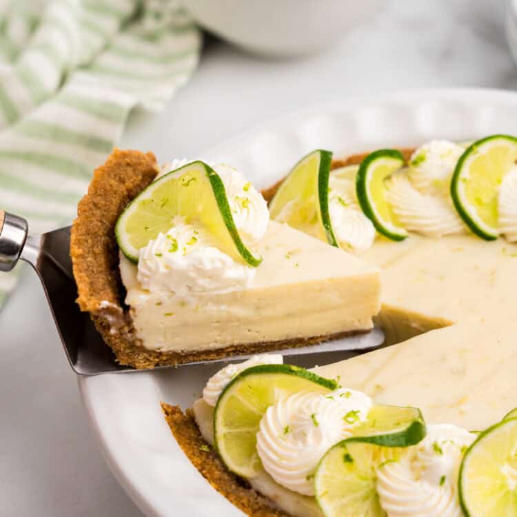 Key Lime Pie slice being pulled from pie plate