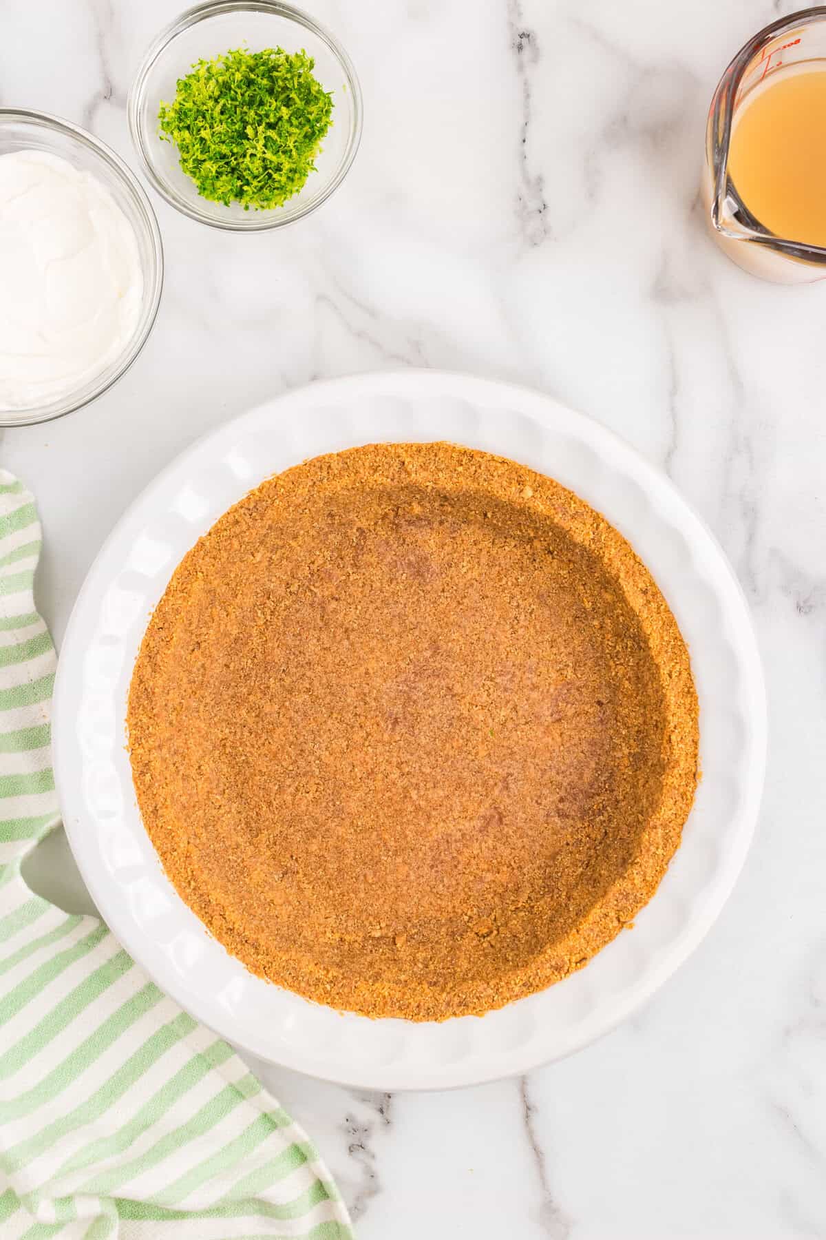 Perfectly pressed Key Lime Pie crust in pie pan