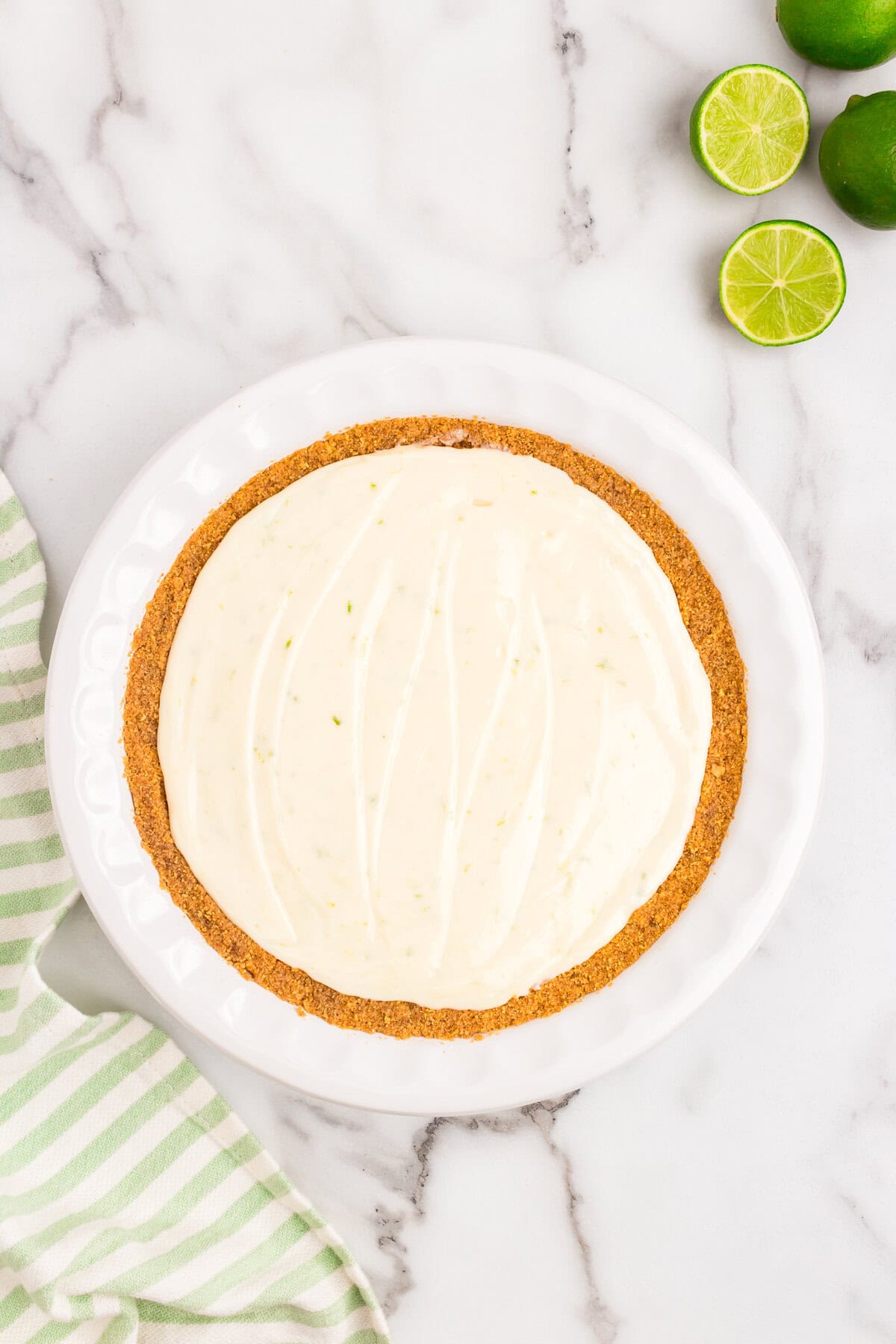 Filling spead into pressed crust for Key Lime Pie recipe