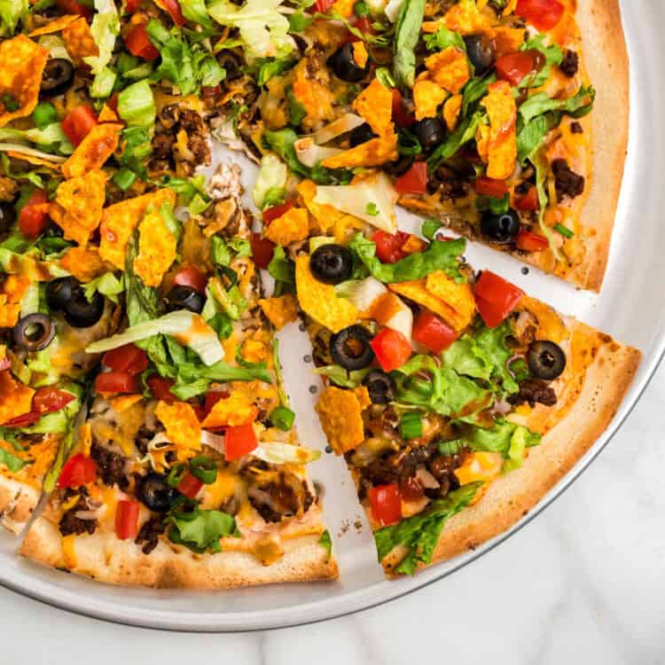Closeup Square Image of Sliced Taco Pizza