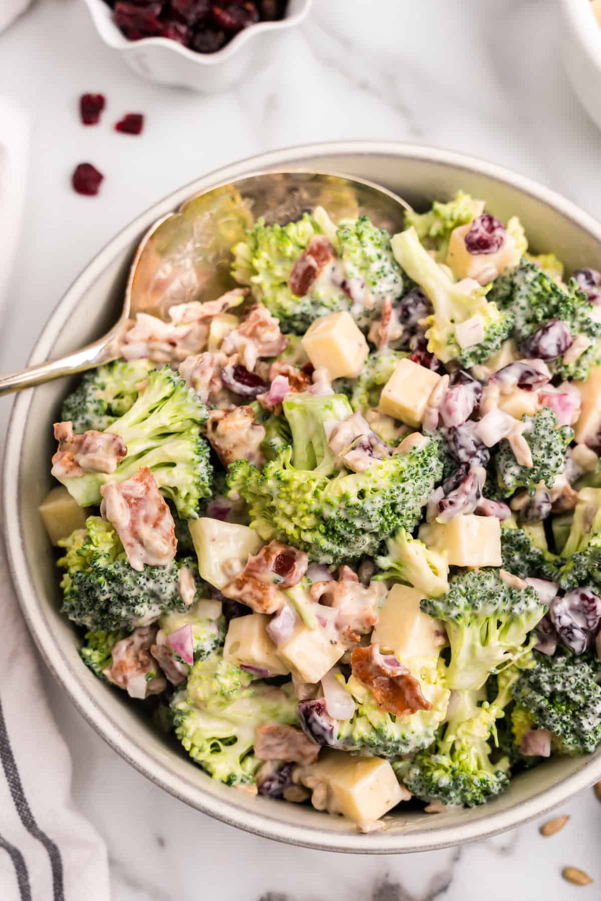 Broccoli Salad in large serving bowl with spoon