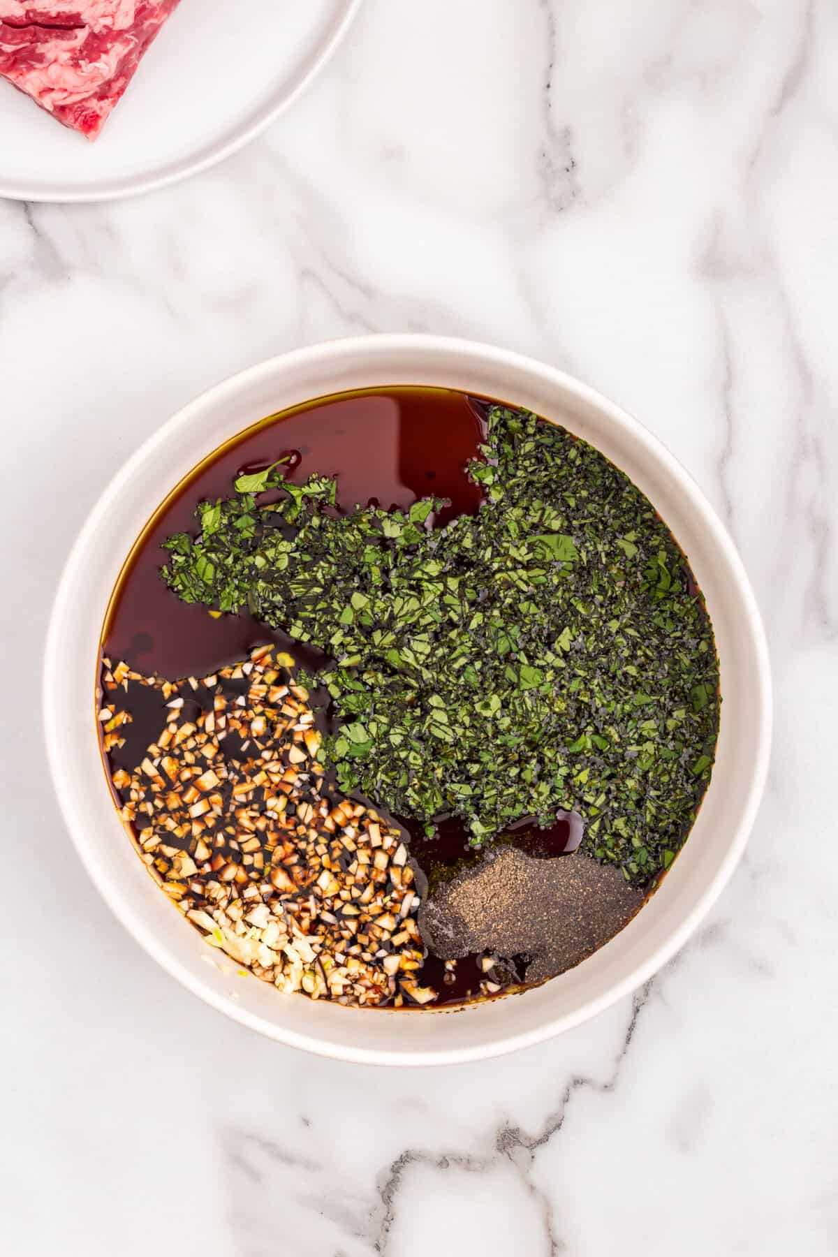 Ingredients for steak marinade in shallow bowl for California Burrito recipe