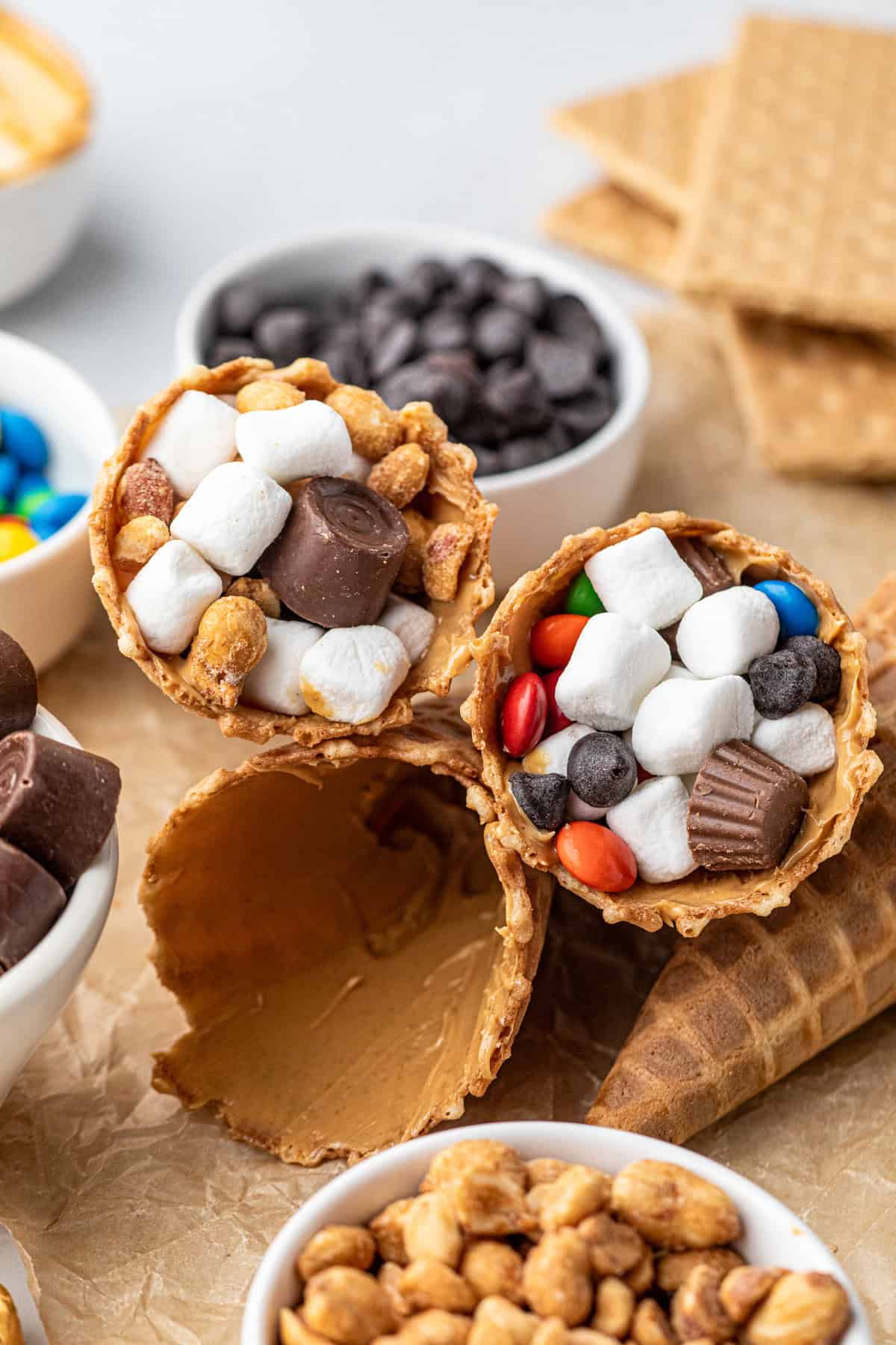 Peanut butter smeared inside waffle cone and then stuffed with a variety of fillers for Campfire Cones recipe
