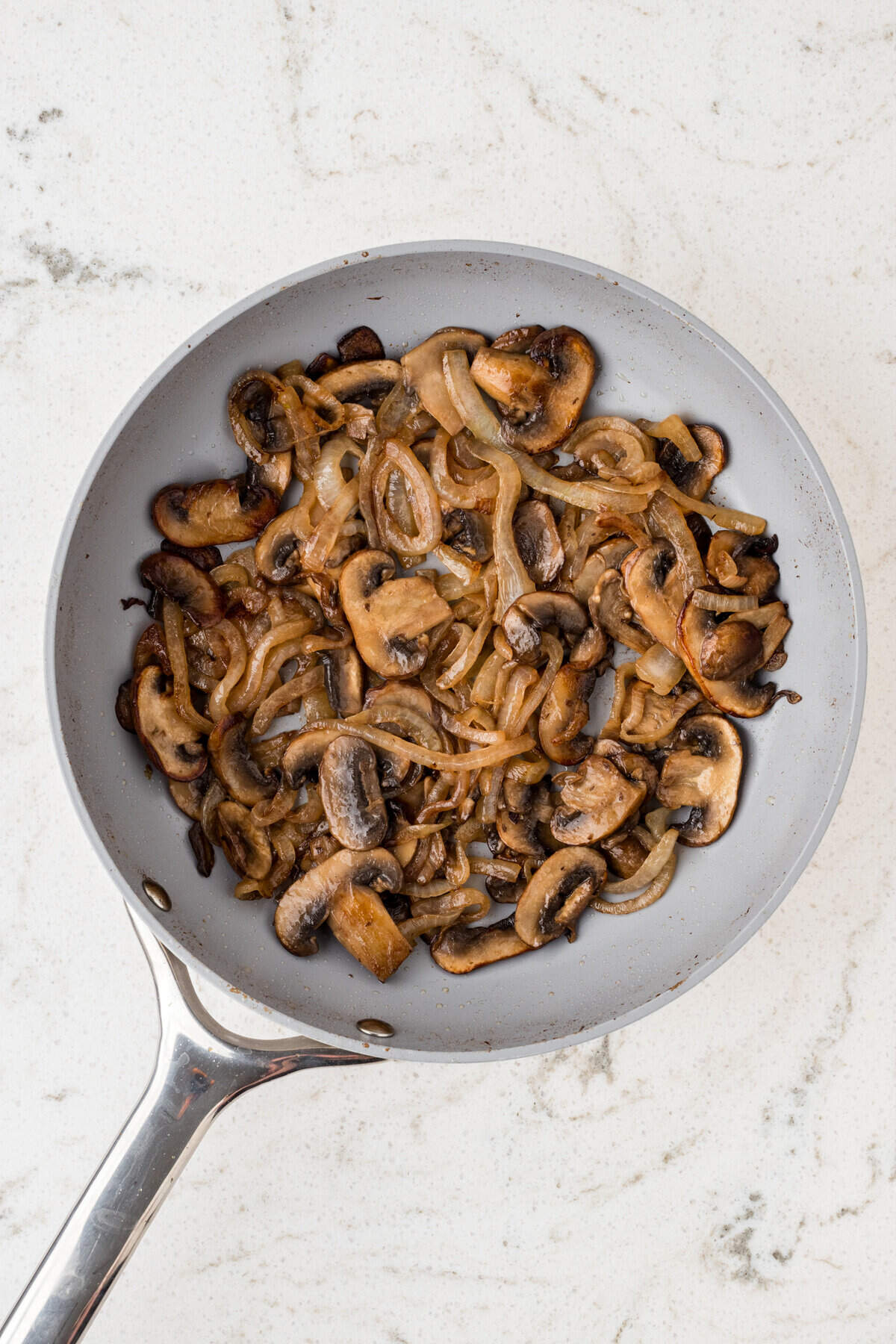 Cooked mushrooms in saute pan for Mushroom Swiss Burger Recipe