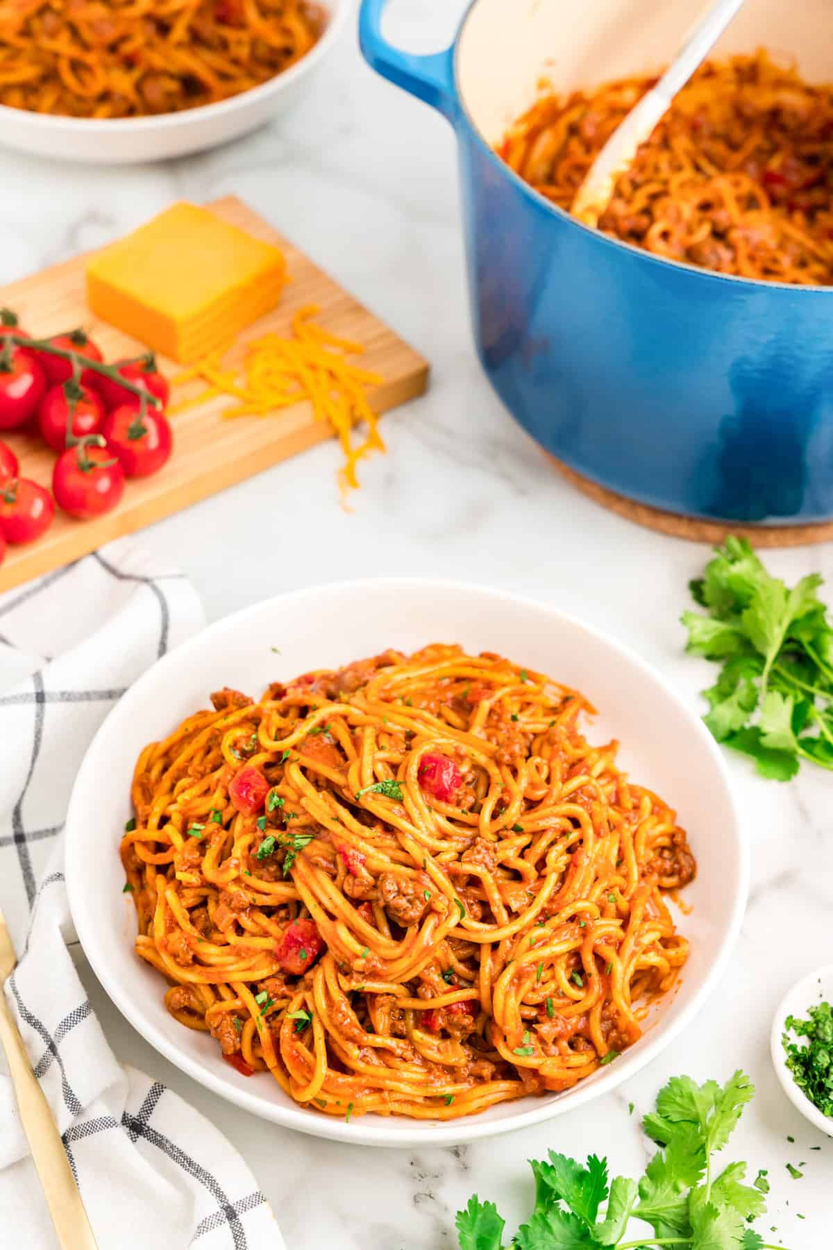 A White plate displaying a serving a Taco Spaghetti.