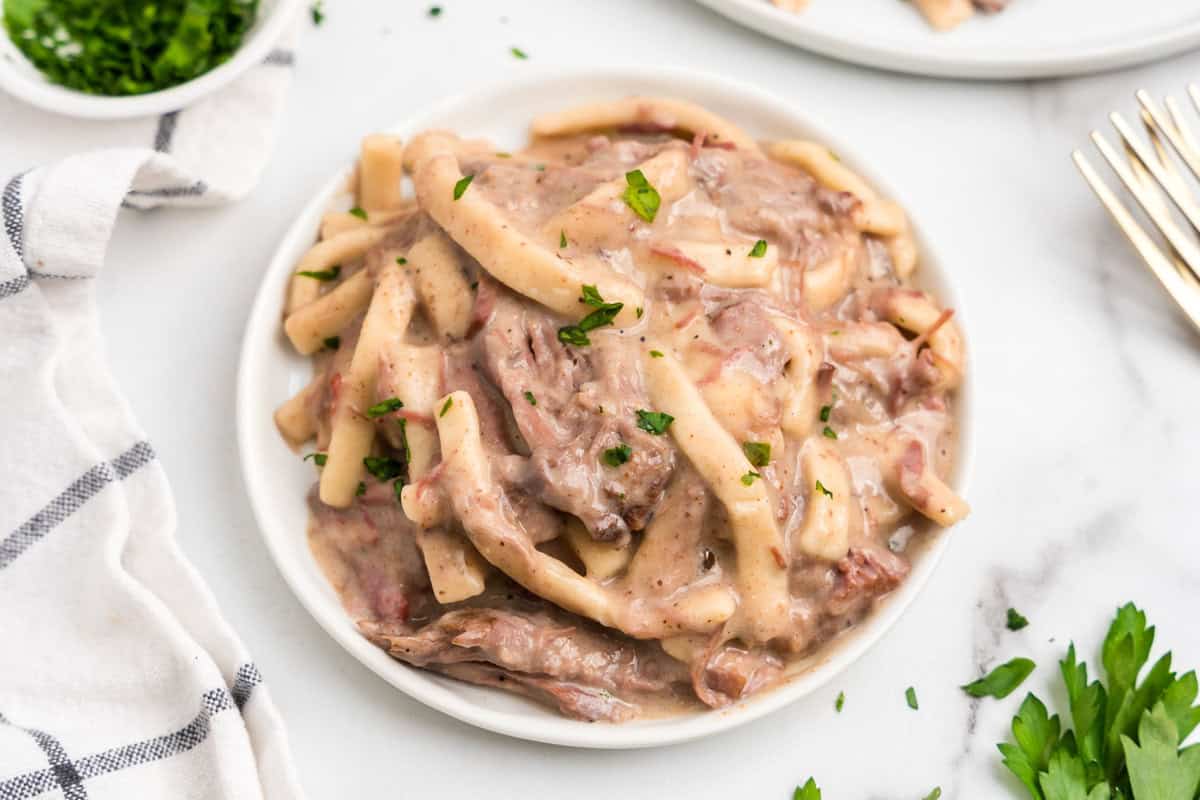 Beef Tips and Noodles in shallow serving bowl