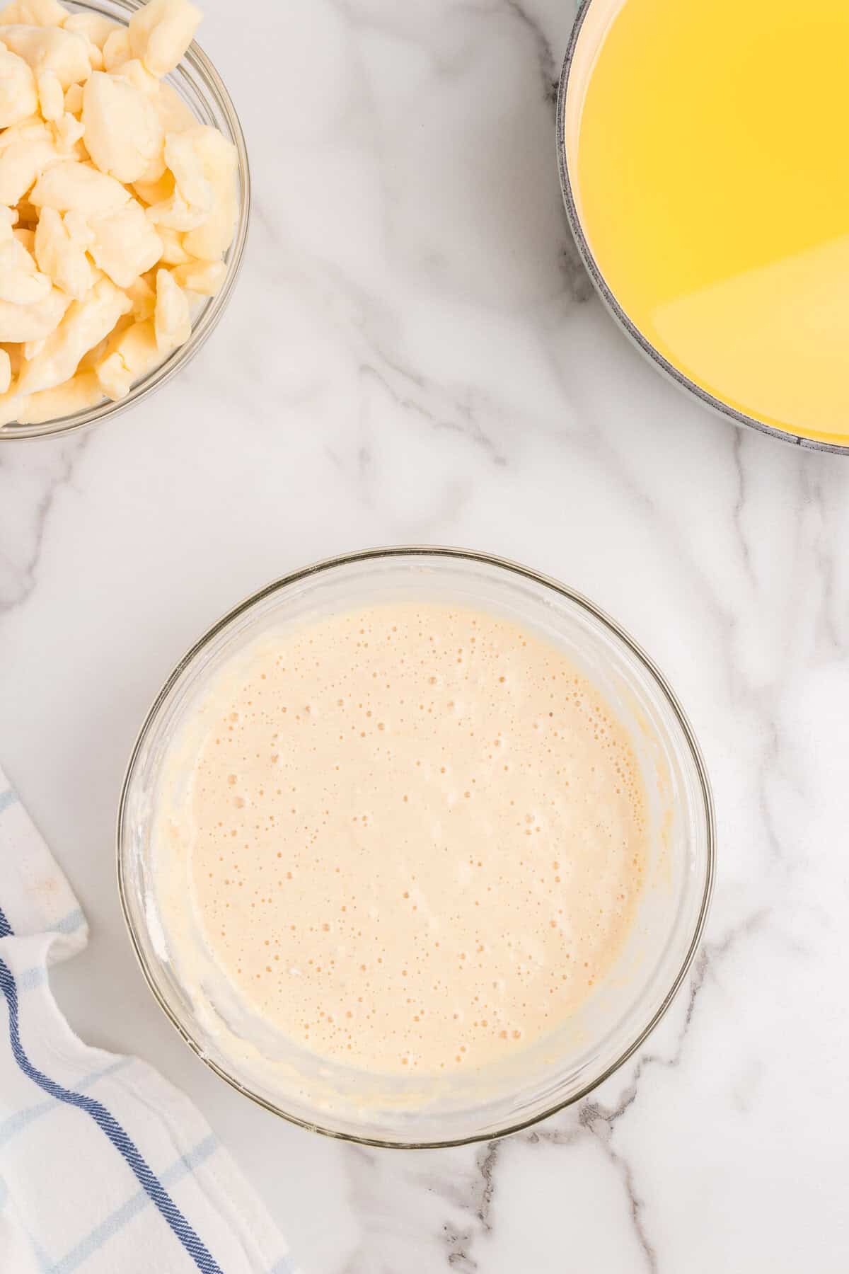 Combined Cheese Curds batter in glass bowl