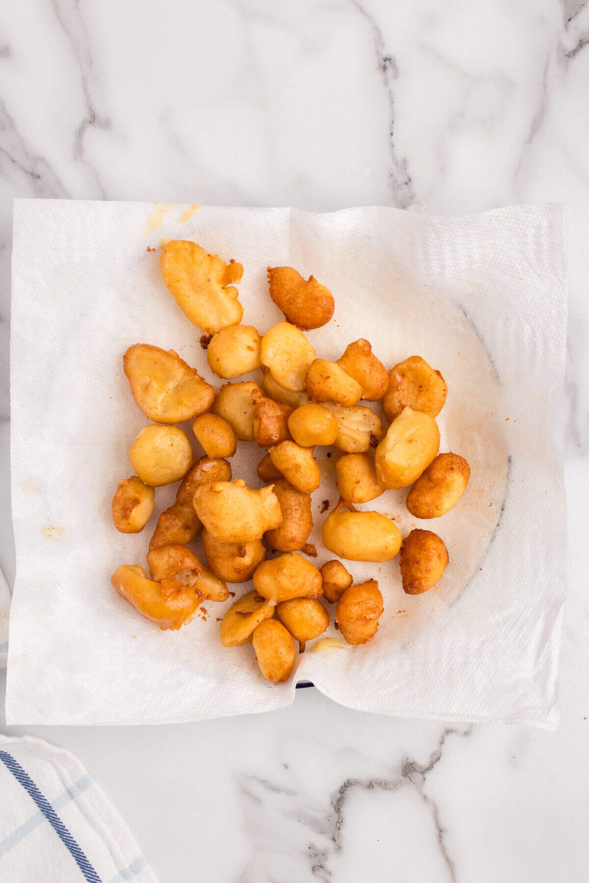 Fried Cheese Curds on paper towel lined plate