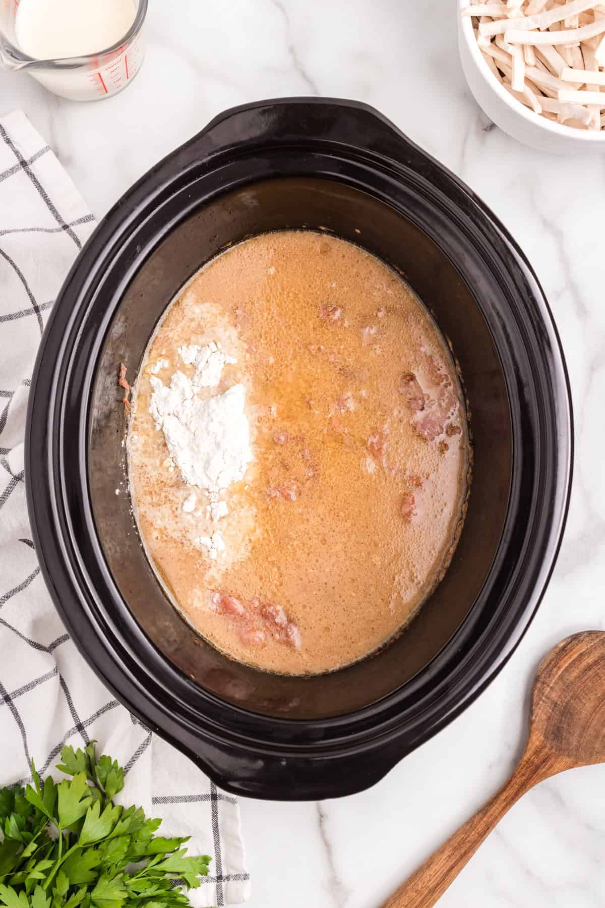Adding flour to crock pot contents for Crock Pot Beef and Noodles