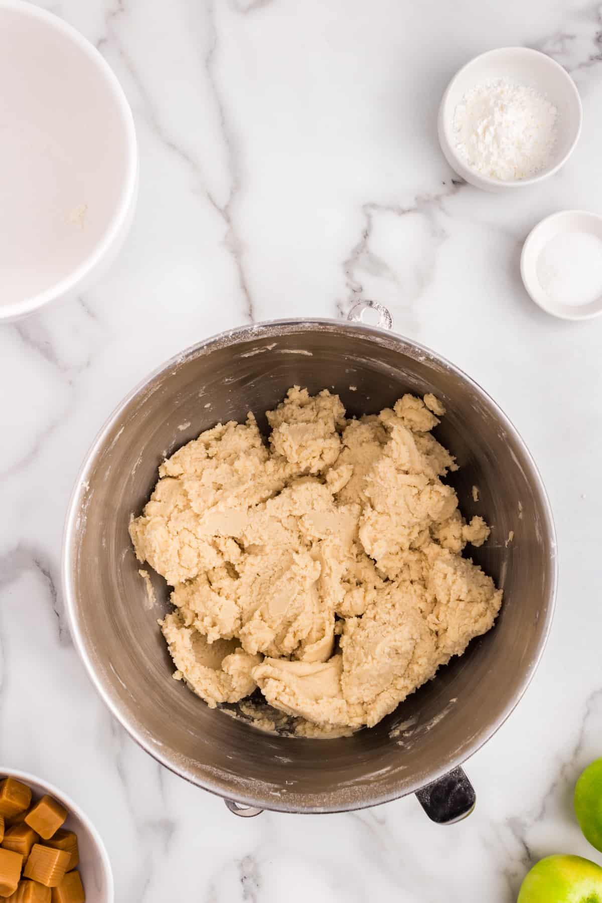 Mixing the crust for Creaming together butter and sugars for Salted Caramel Apple Butter Bars recipe in mixing bowl