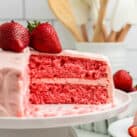 Closeup square image of Strawberry Cake sliced on cake plate
