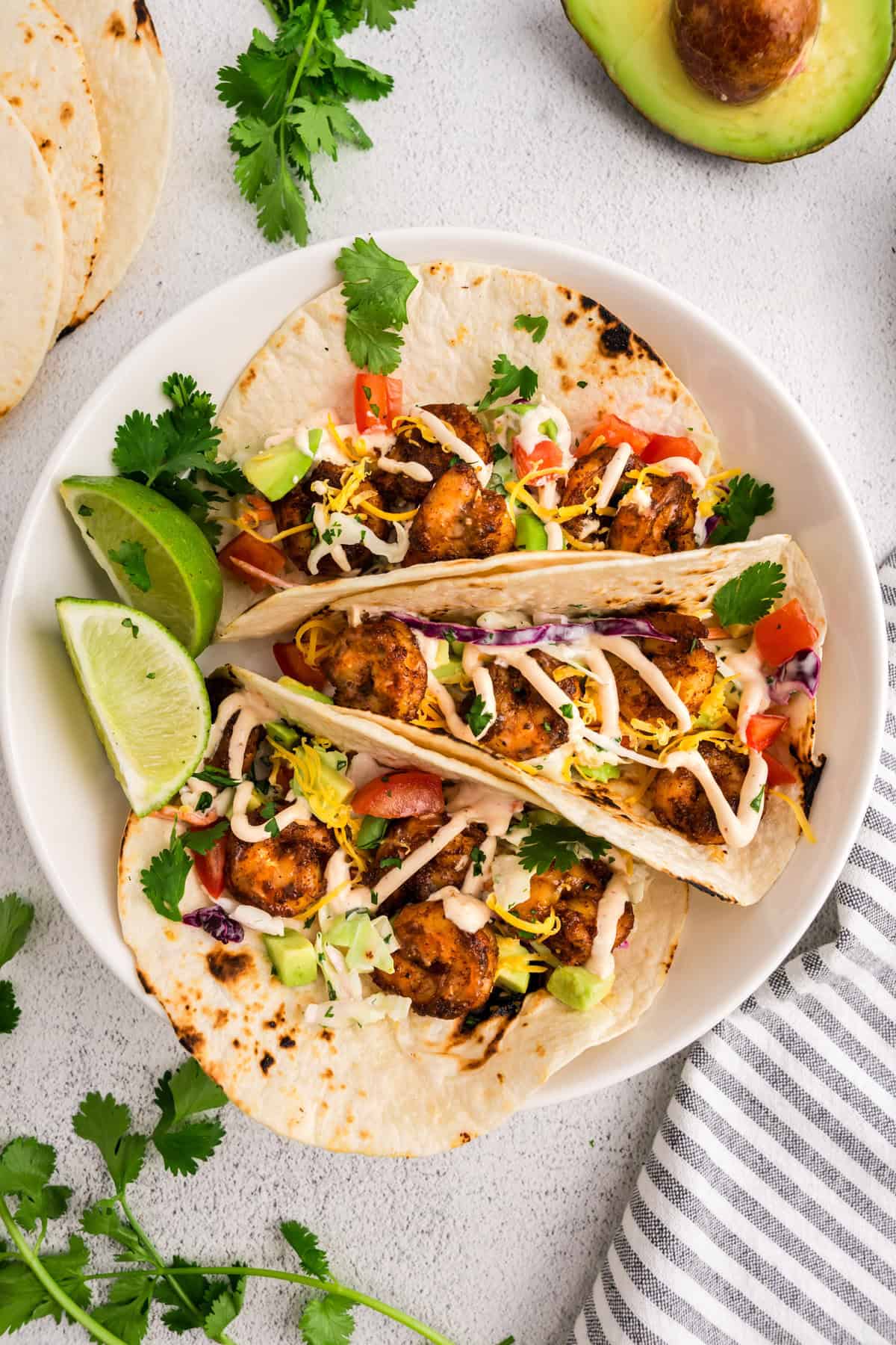 Baja Shrimp Tacos loaded with toppings and plated 