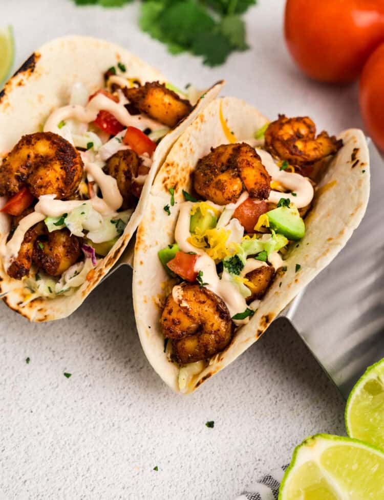 Baja Shrimp Tacos assembled and loaded with toppings