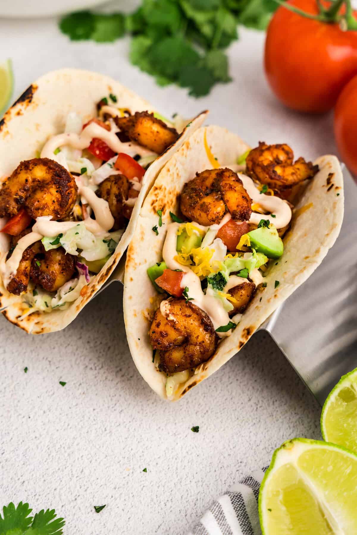 Baja Shrimp Tacos assembled and loaded with toppings