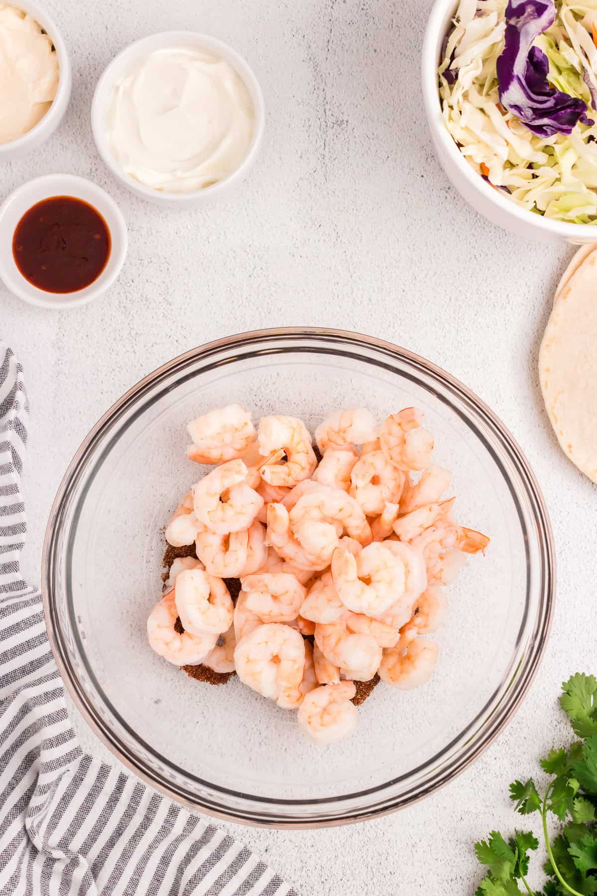 Prepared shrimp added to seasonings for Baja Shrimp Tacos recipe