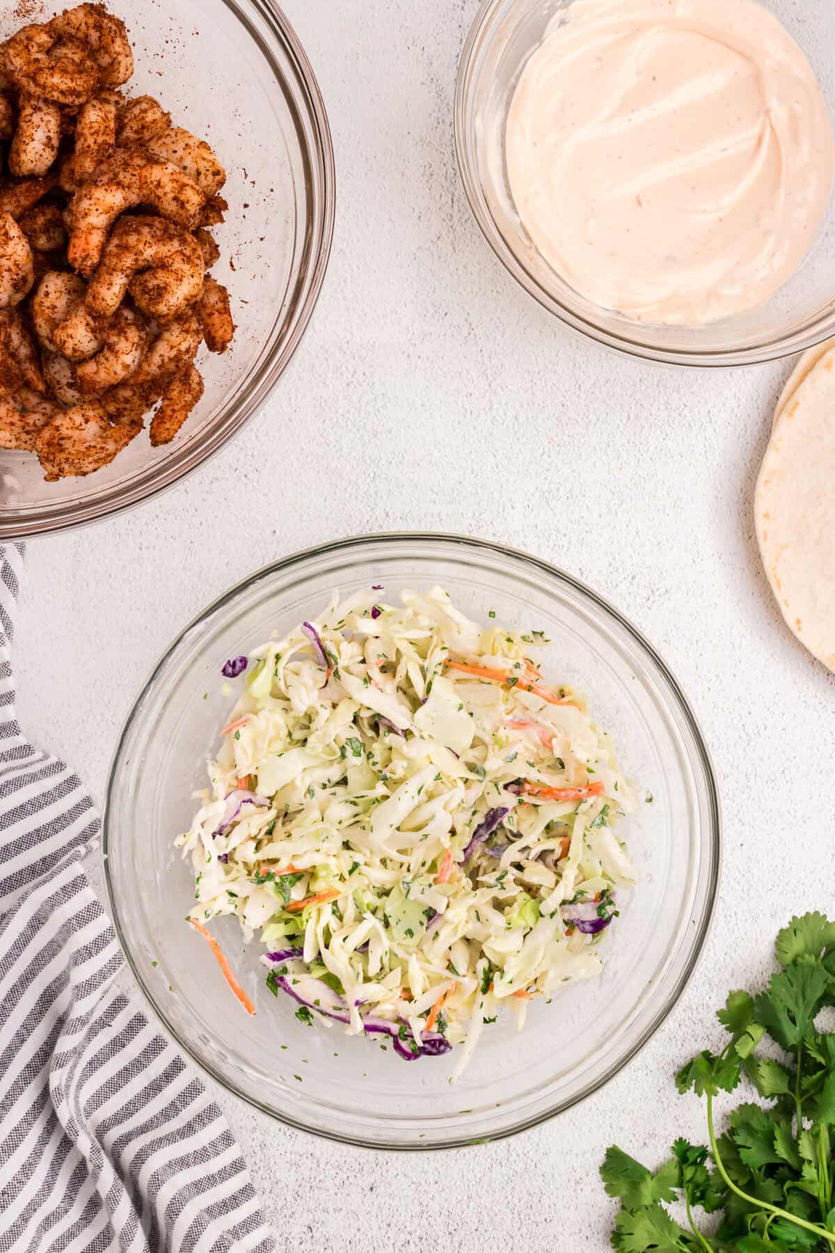 Baja Shrimp Tacos coleslaw in mixing bowl