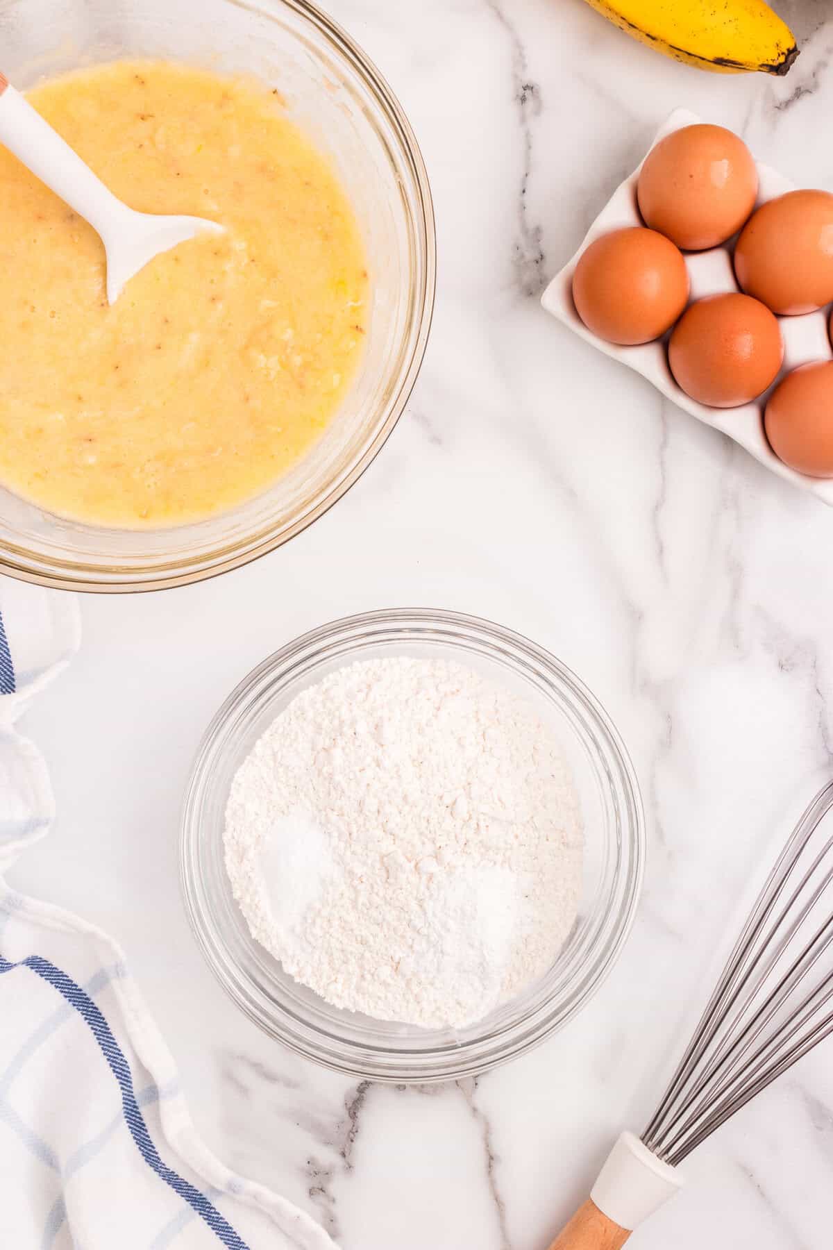 Whisking dry ingredients for Banana Crumb Muffins in small mixing bowl