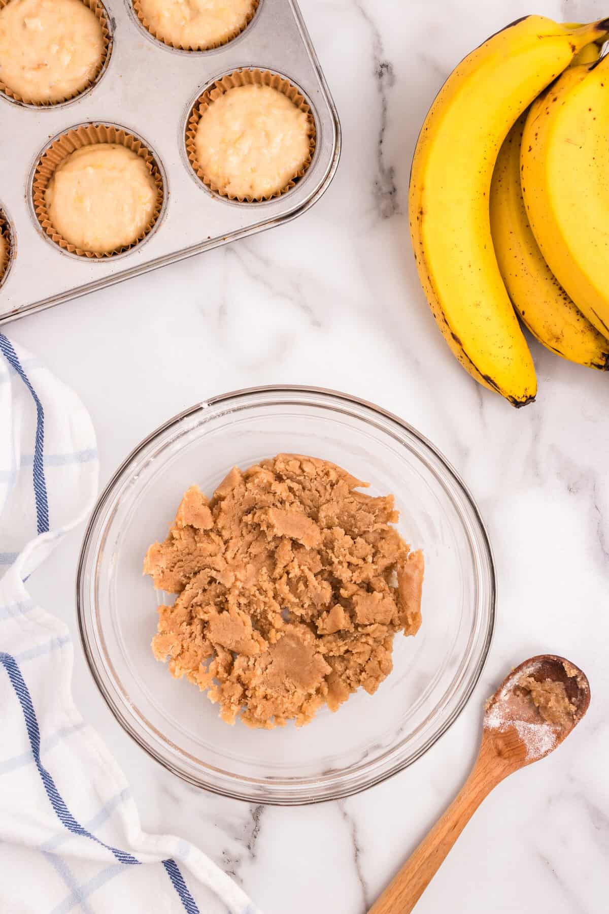 Banana Crumb Muffins crumb topping in glass mixing bowl
