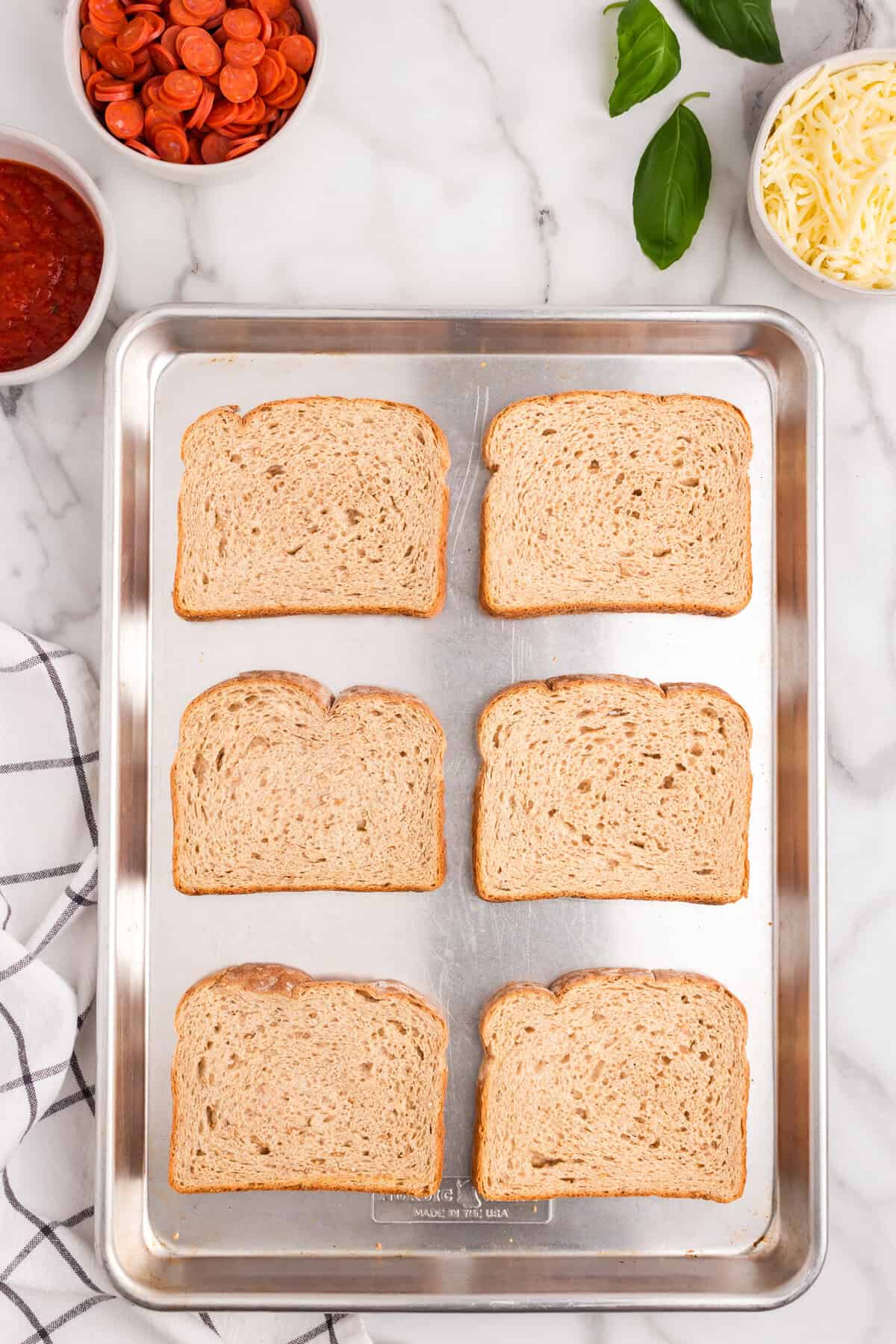 Place bread slices on to a pan and place in the oven at 400 for 5 minutes.