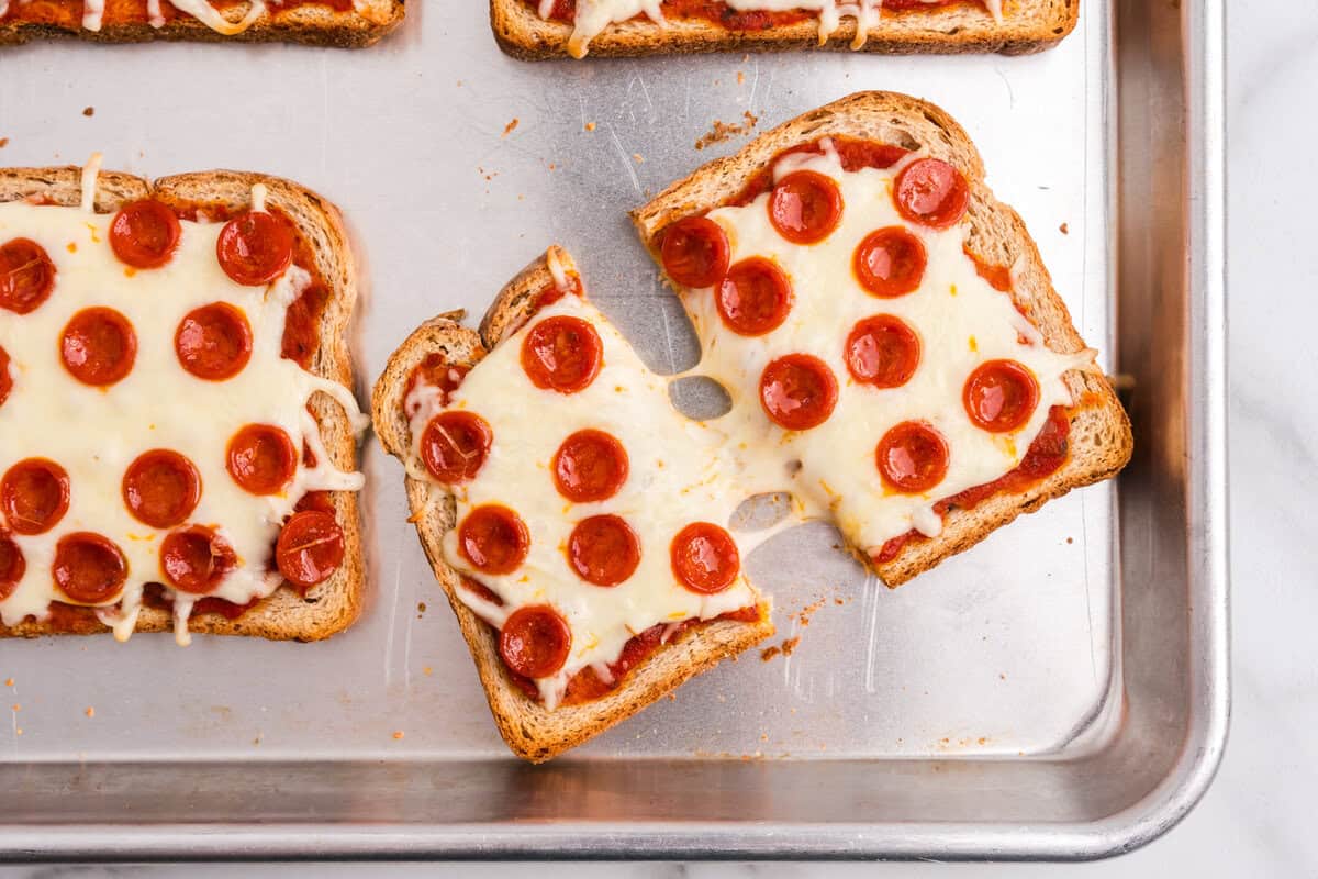 Close up photo of pizza toast cut in half.