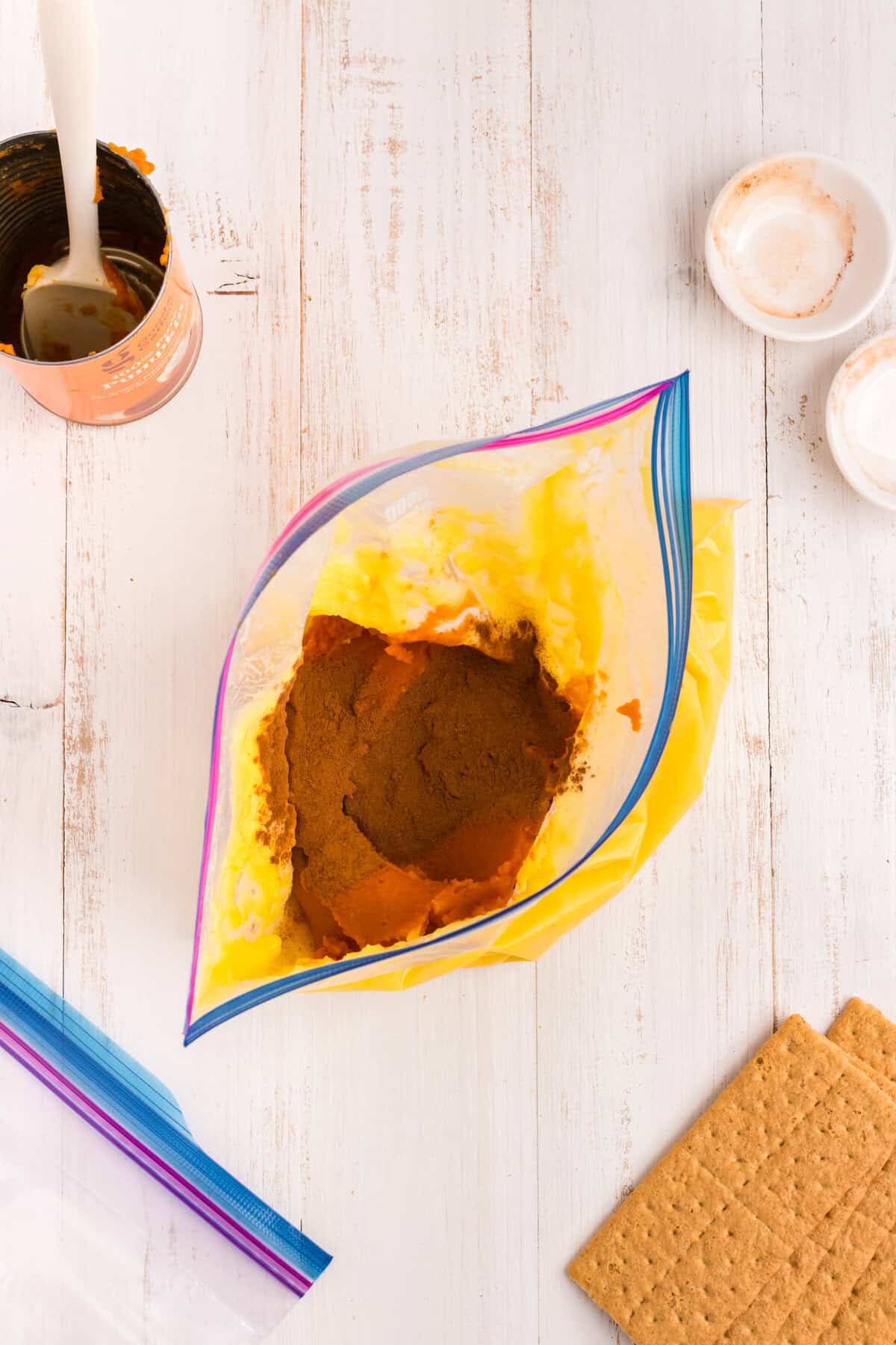 The gallon zip lock opened to add the spices for the Pumpkin Pie in a Bag recipe