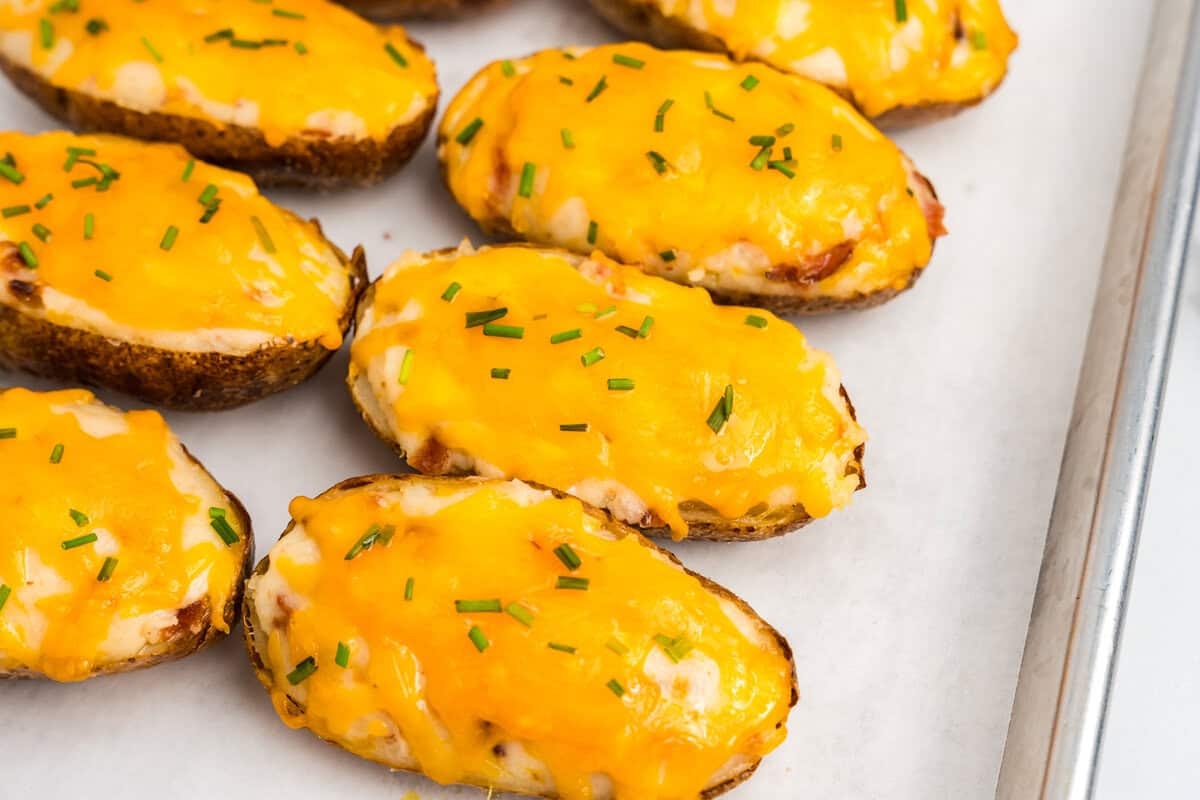 Twice Baked Potatoes arranged on parchment-lined baking sheet
