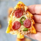 Hand holding Christmas Tree Mini Pizza