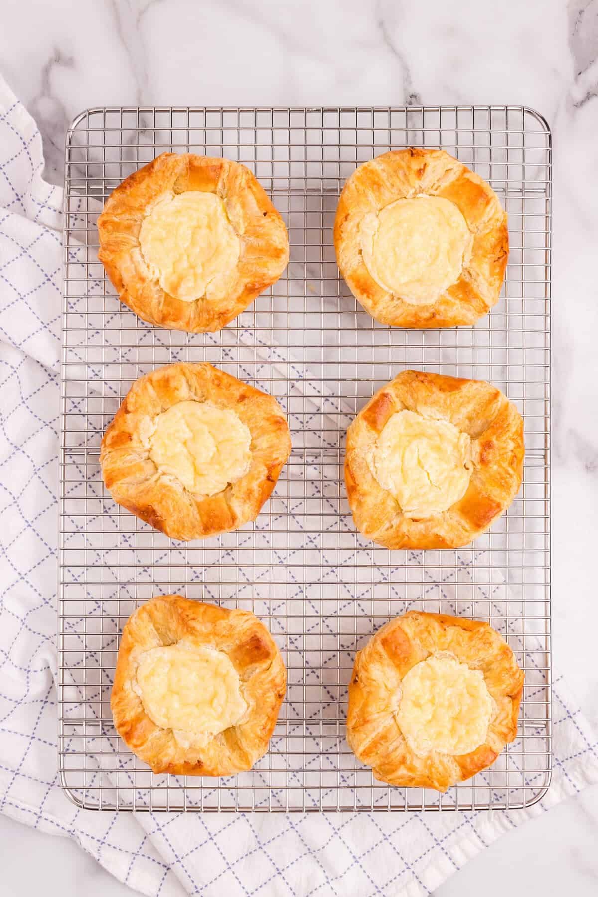 After baking, cooling the Cream Cheese Danishes on a wire cooling rack