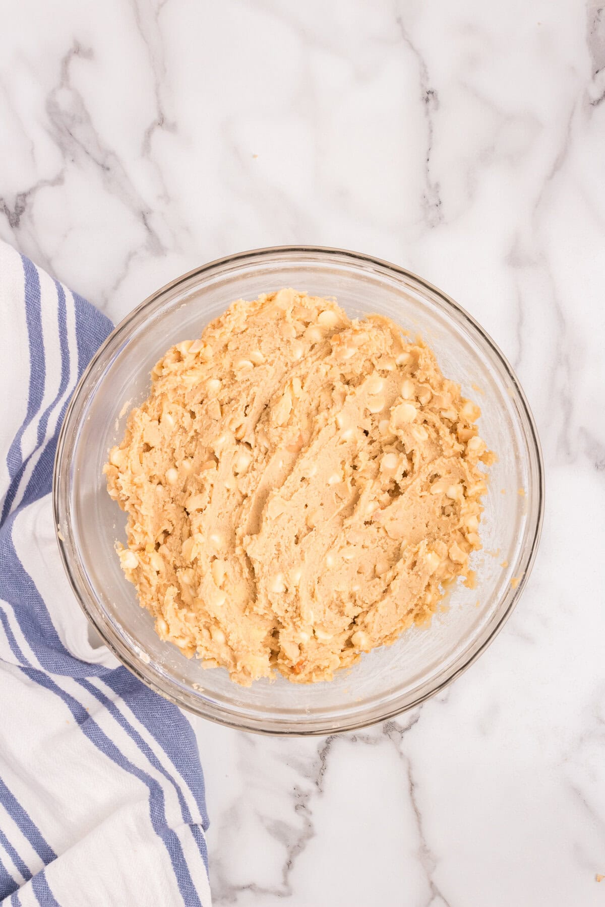 Combine Macadamia Nut and White Chocolate Cookies ingredients in glass mixing bowl